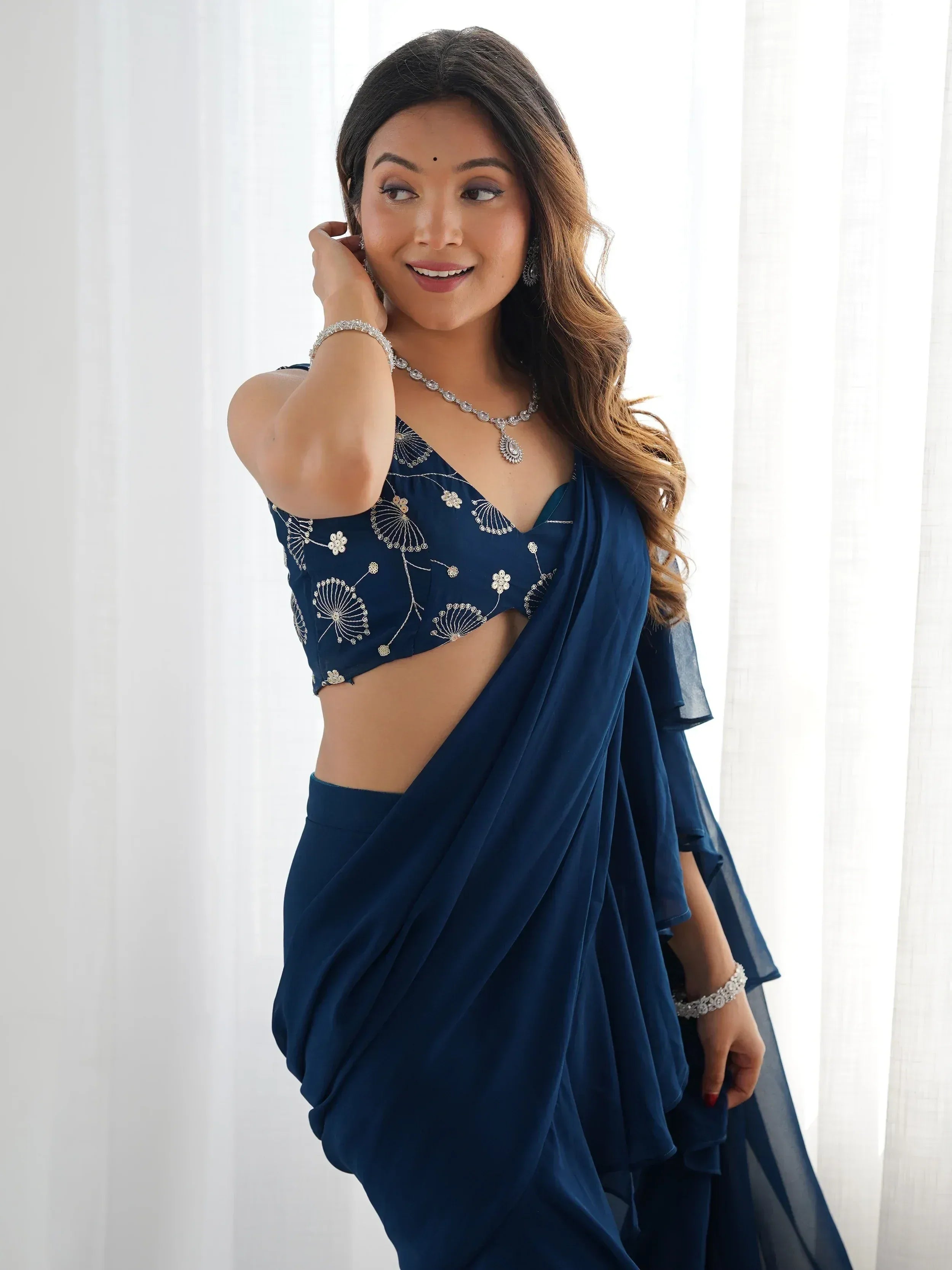 Navy blue embroidered saree with floral blouse, perfect for Indian ethnic wear occasions