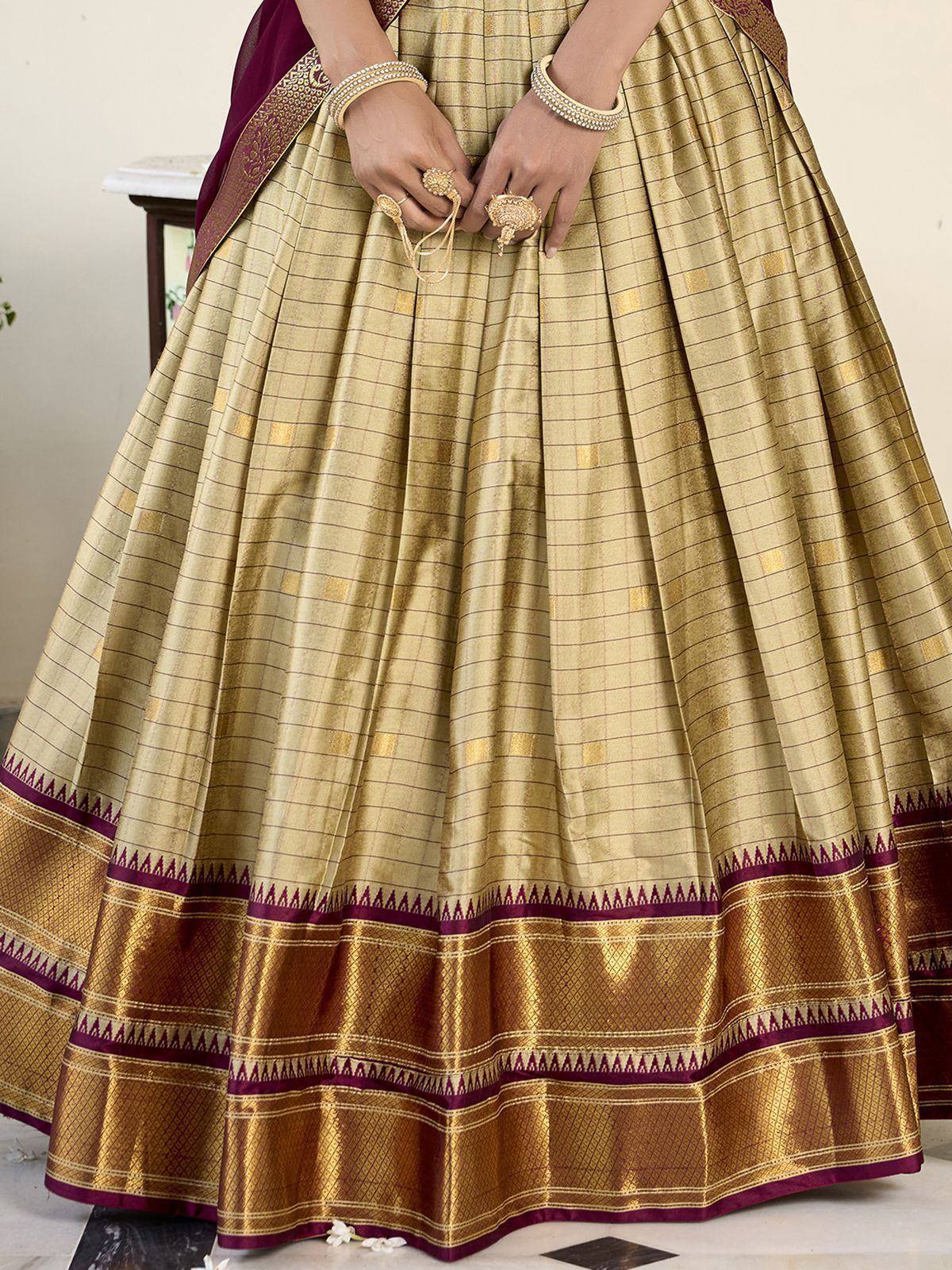 Gold and maroon checkered lehenga with intricate border, perfect for Indian ethnic wear
