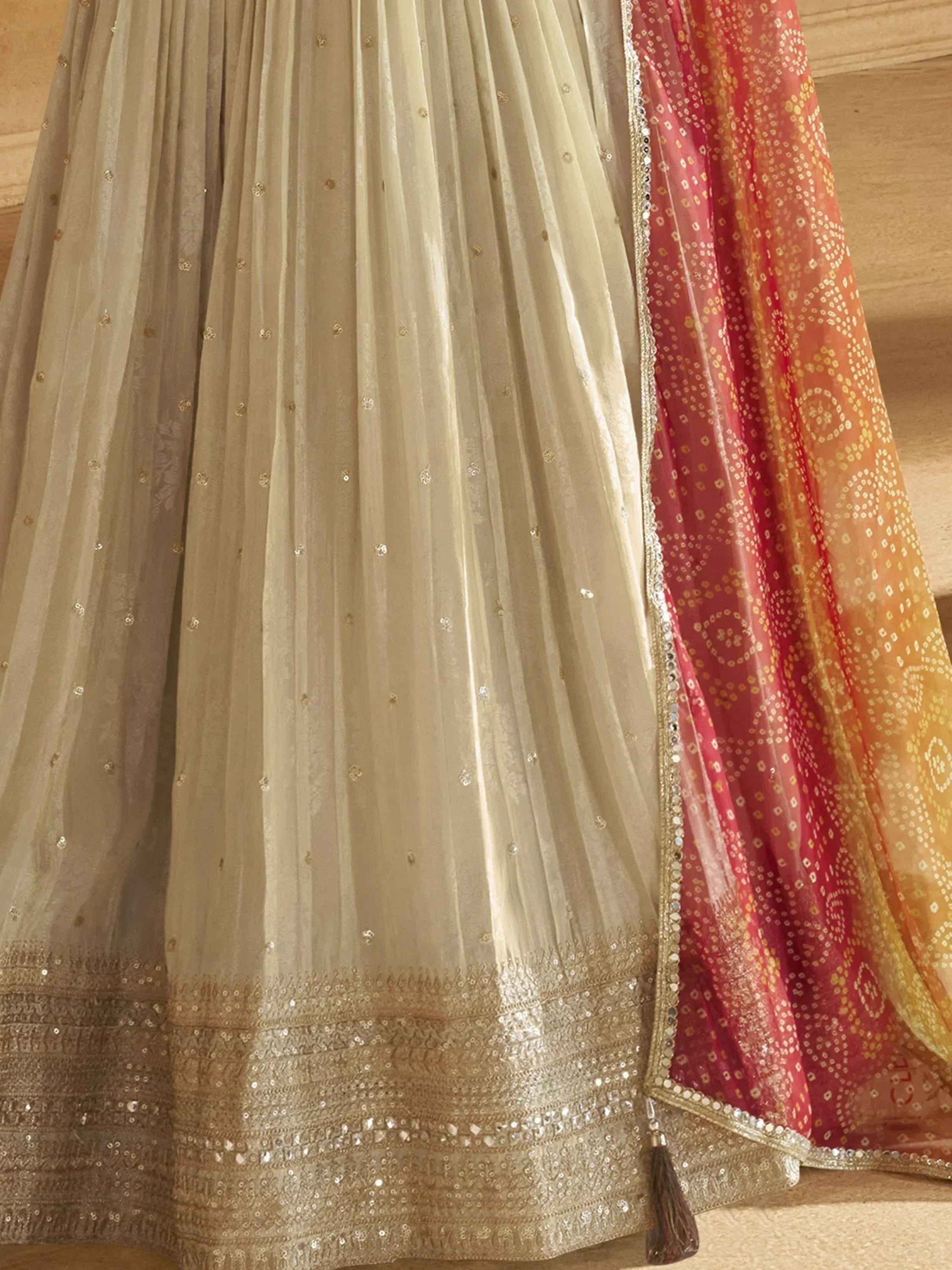 Beige embroidered lehenga with sequin detailing and pink-orange dupatta, Indian ethnic wear