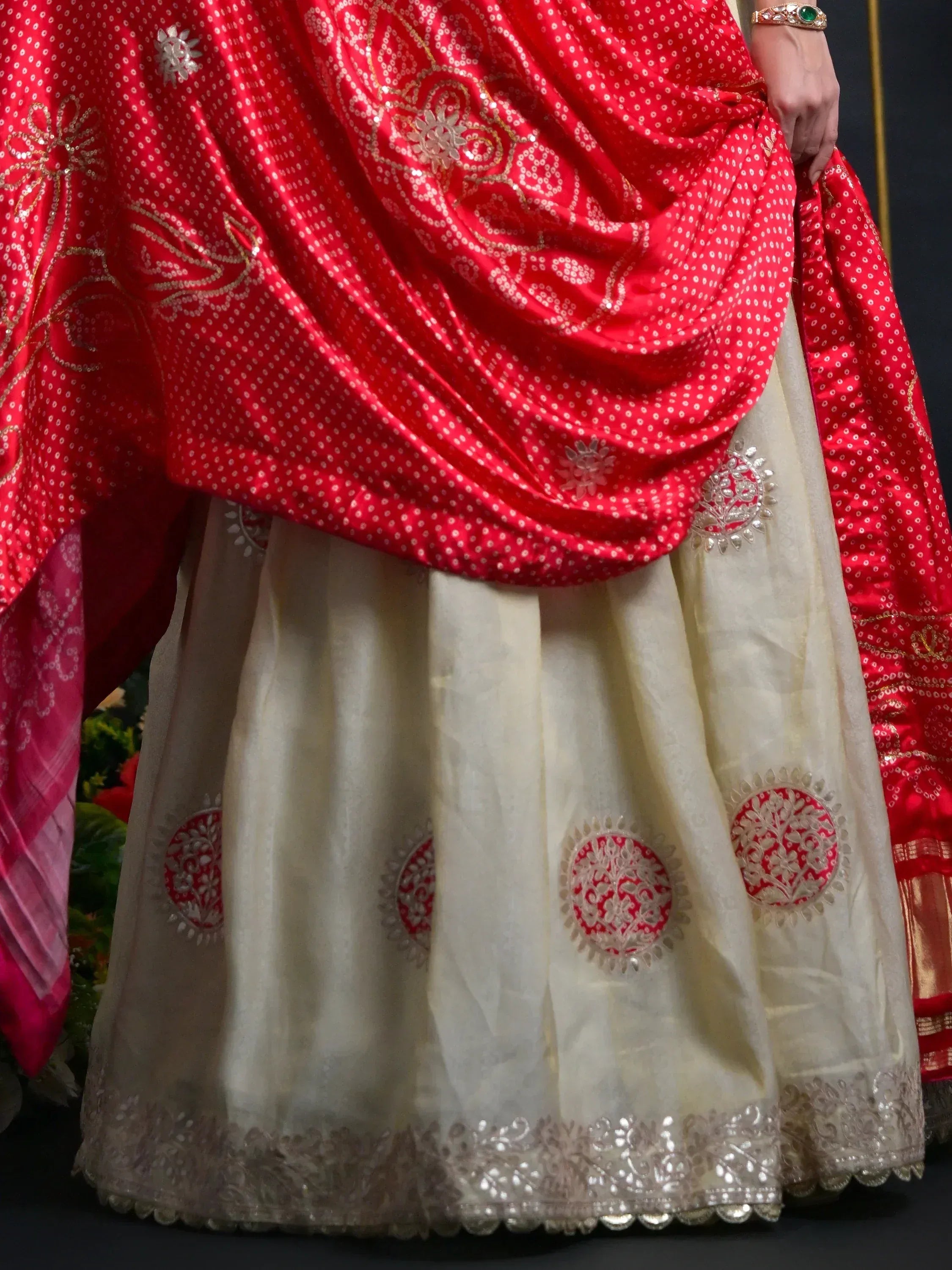 Red and cream designer lehenga choli with gold embroidery and sequin work, perfect for Indian ethnic wear.