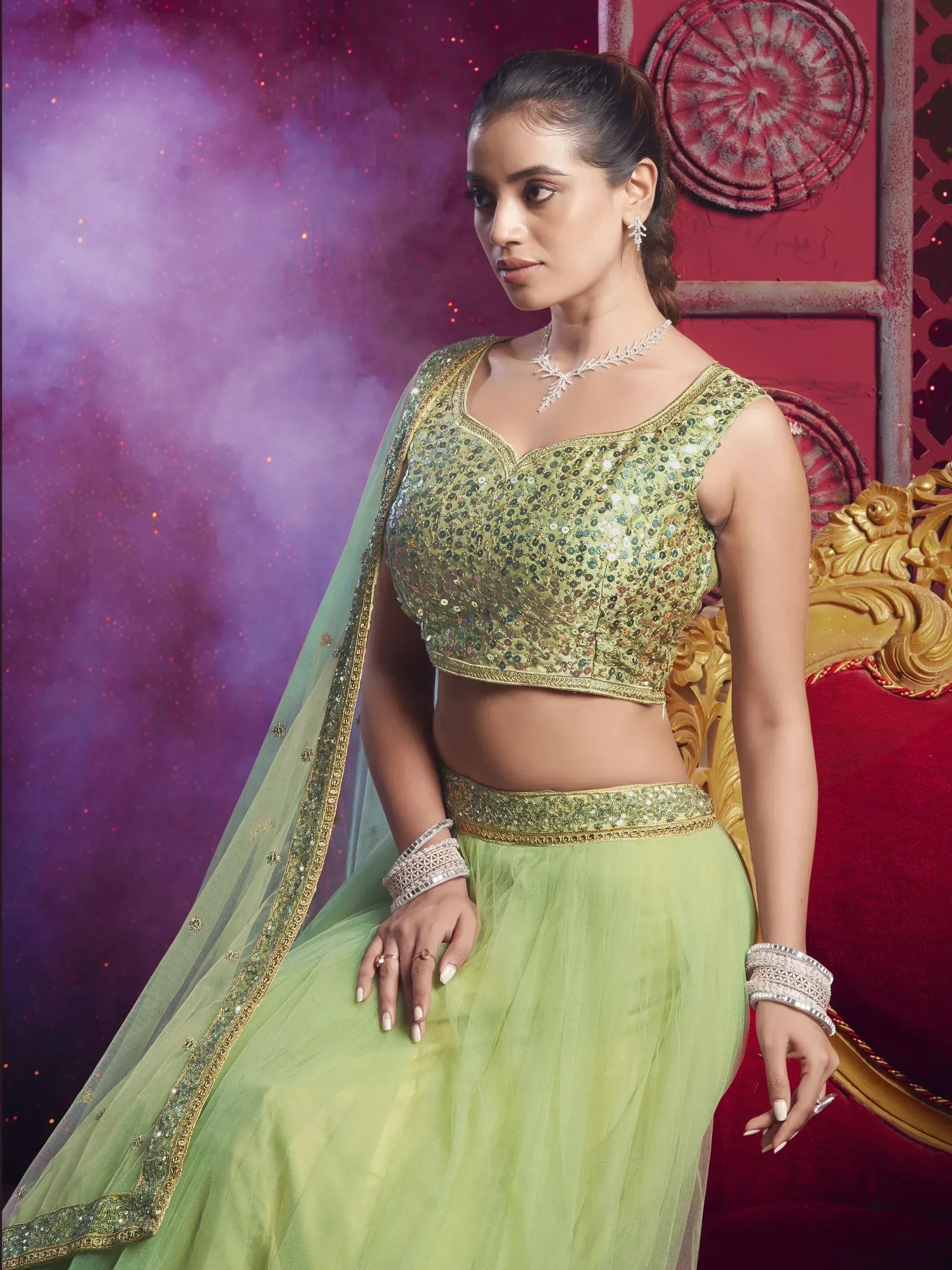 Green sequin lehenga choli with sheer dupatta, perfect for Indian ethnic wear and festive occasions.