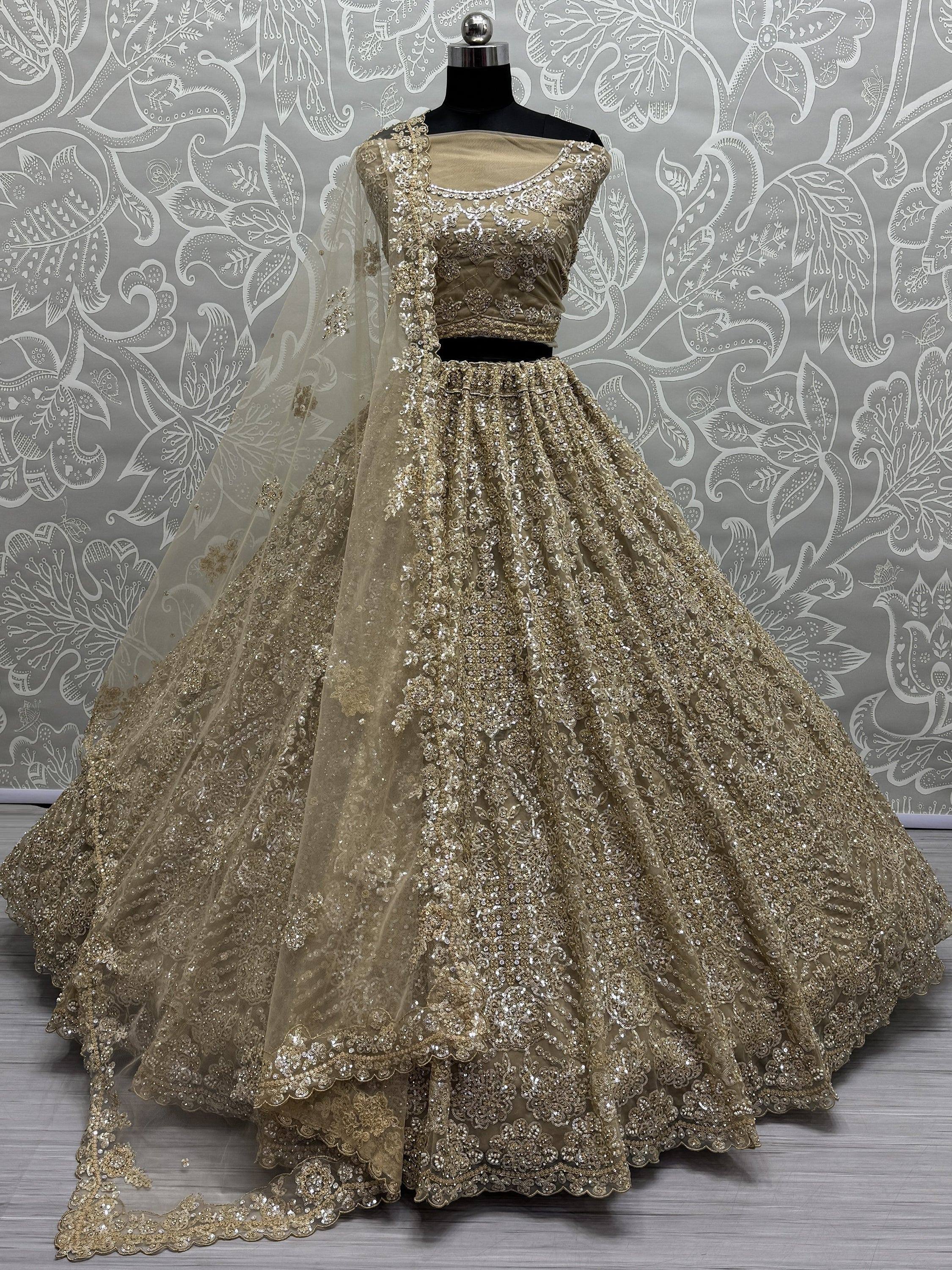 Gold embroidered lehenga choli with net dupatta, designer Indian ethnic wear for weddings