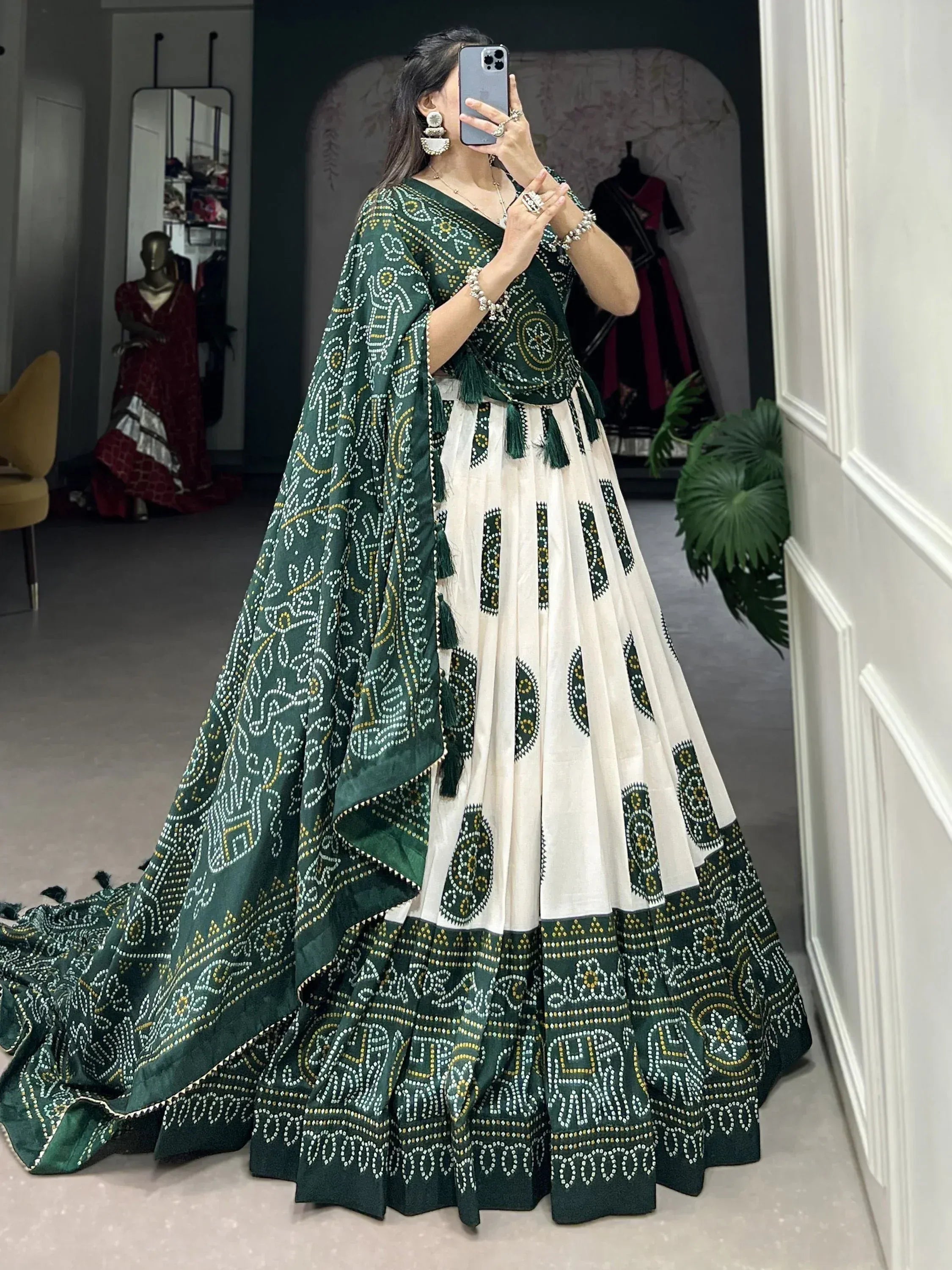 Green and white embroidered lehenga choli with mirror work, perfect for Indian ethnic wear occasions