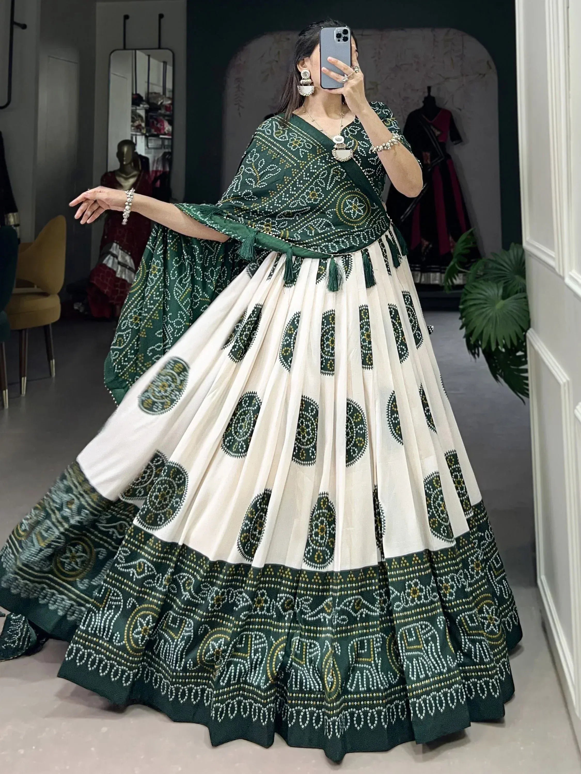 Green and cream printed lehenga choli with ethnic motifs, perfect for Indian weddings and festive occasions.