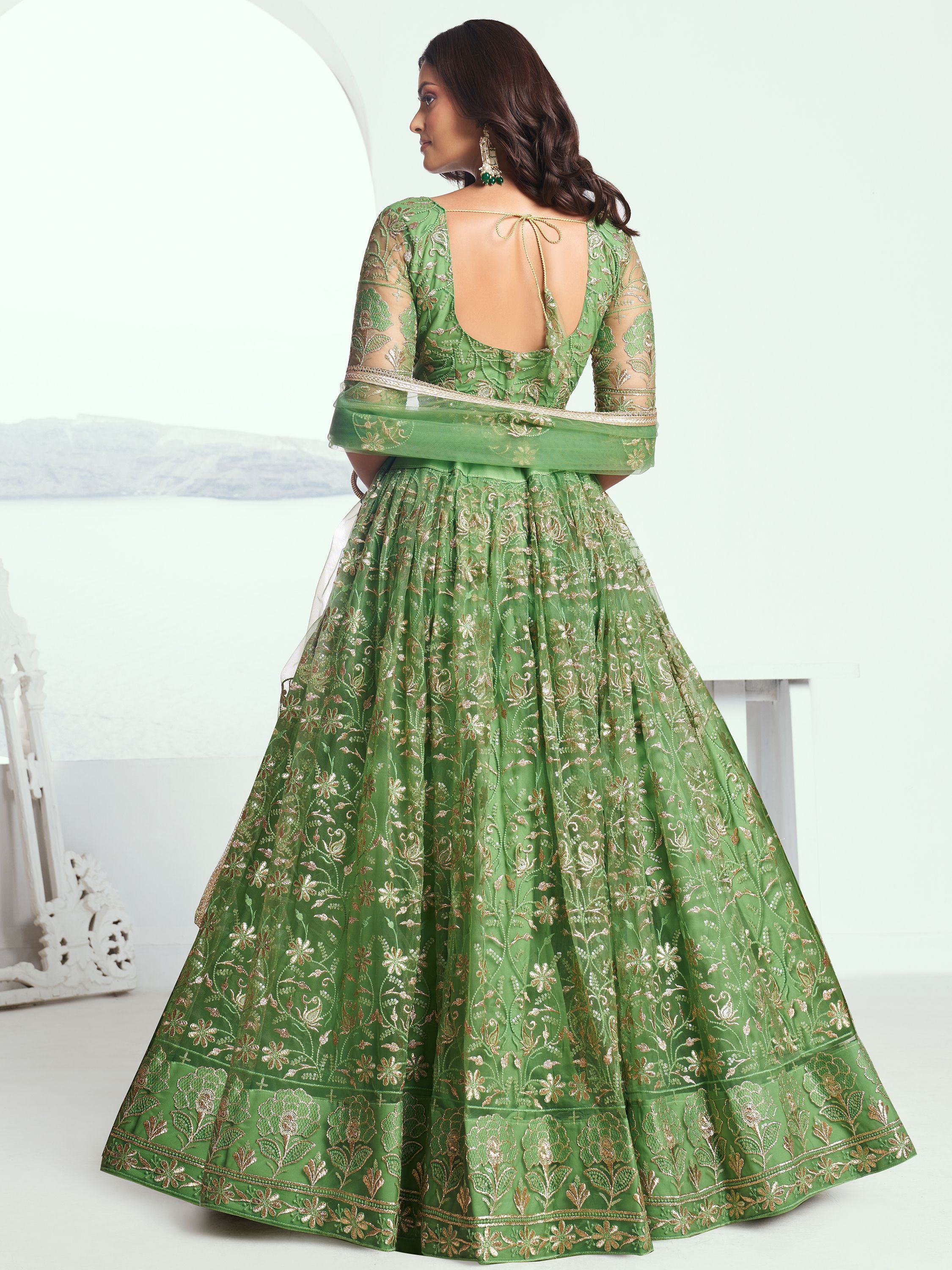 Green embroidered lehenga choli with gold floral work and back tie detail, ideal for Indian ethnic wear.