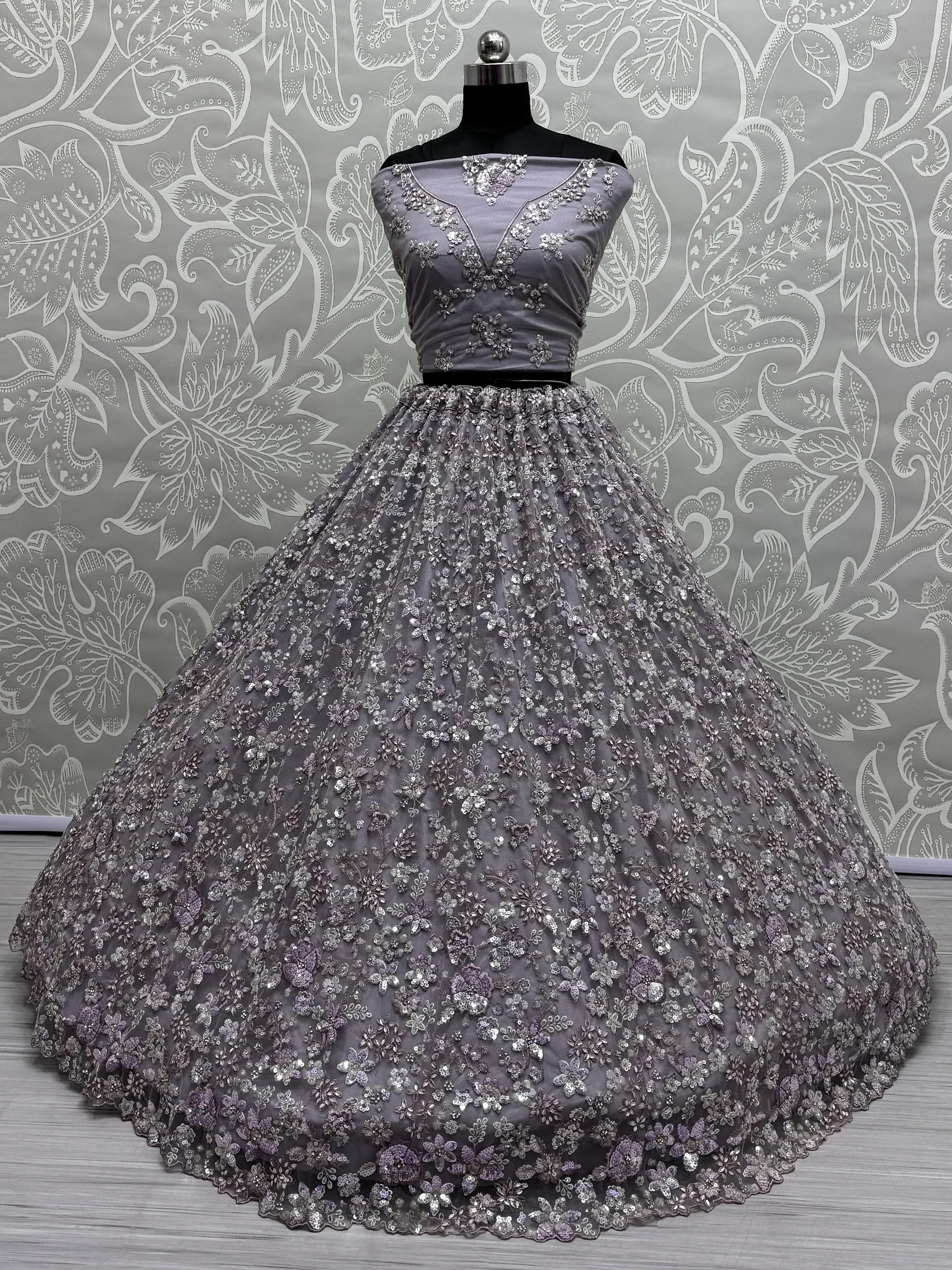 Elegant grey ethnic gown with floral embroidery and sequins, perfect for weddings and parties