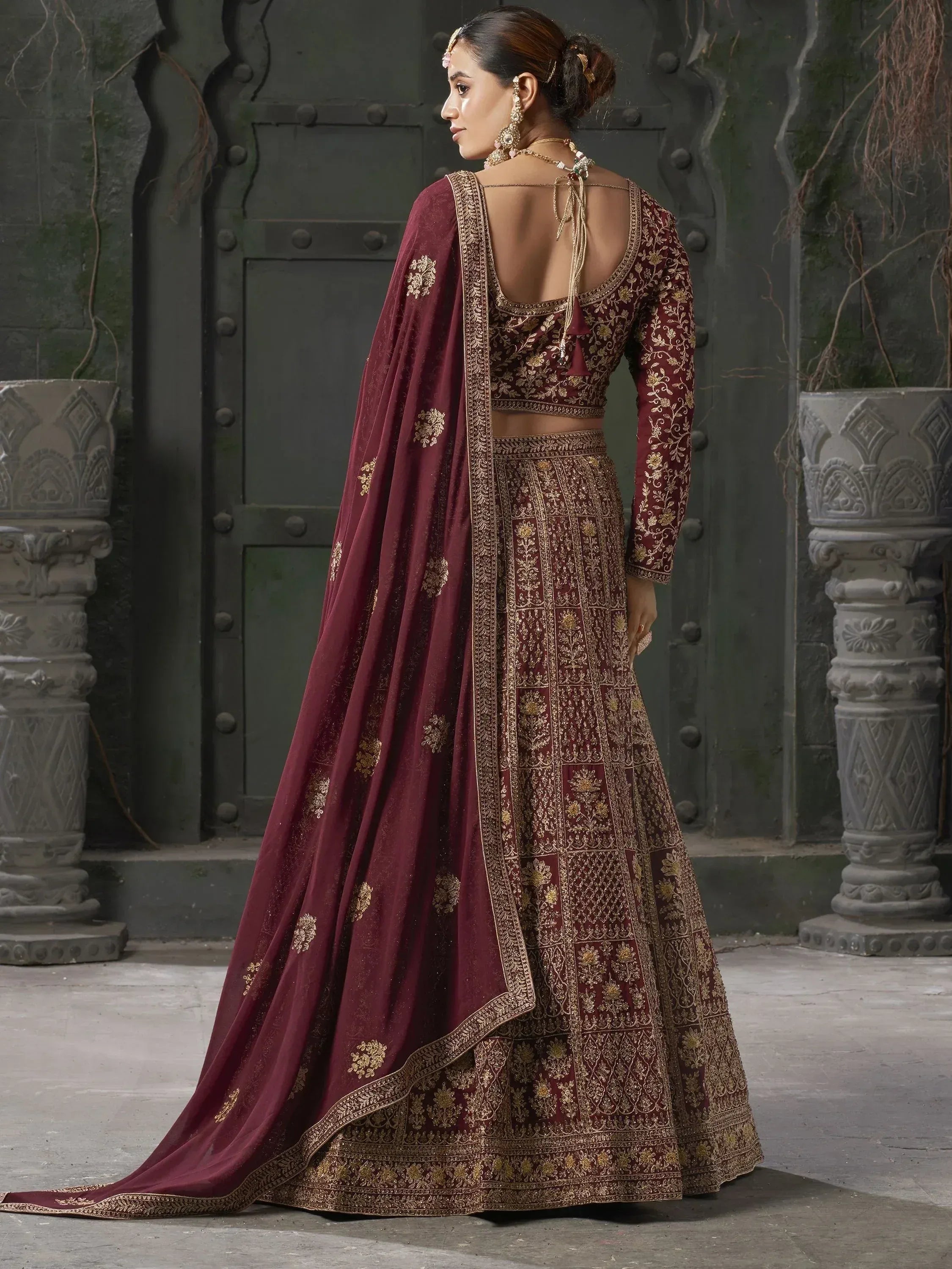 Maroon designer lehenga choli with gold embroidery, perfect for Indian weddings and ethnic events