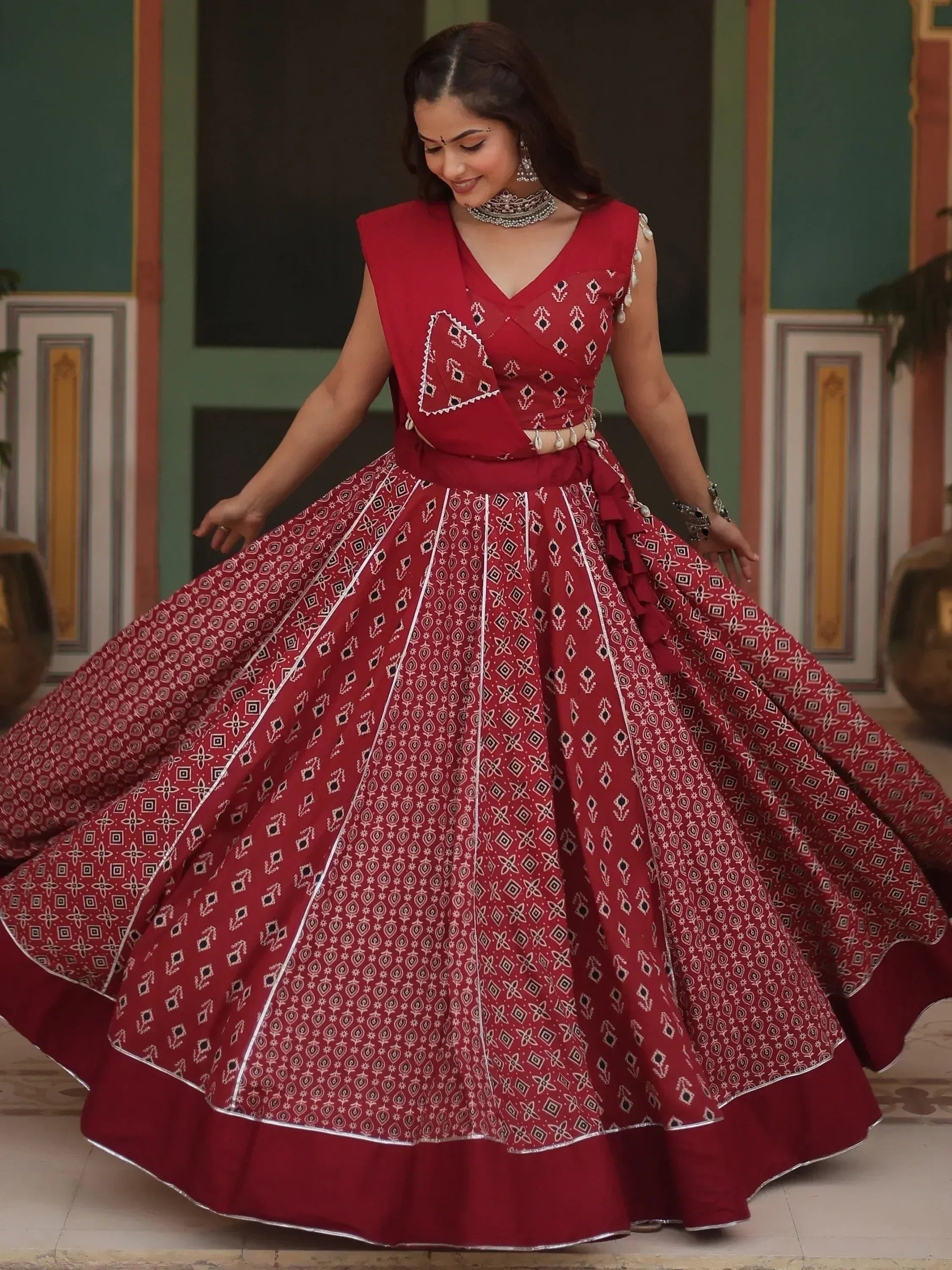 Red printed lehenga choli with geometric patterns, perfect for Indian ethnic wear and festive occasions