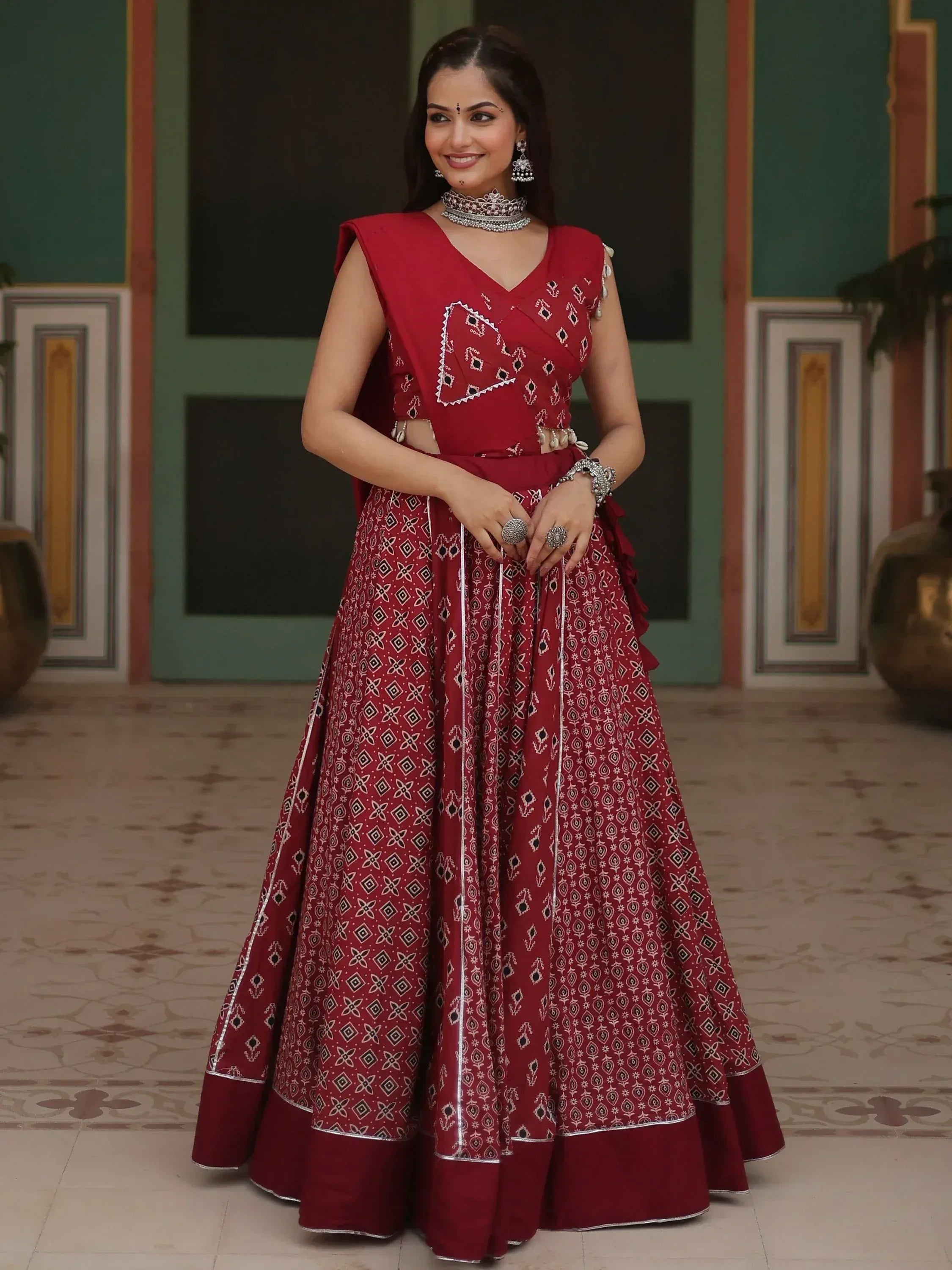 Red printed lehenga choli with silver embroidery, perfect for Indian ethnic wear occasions