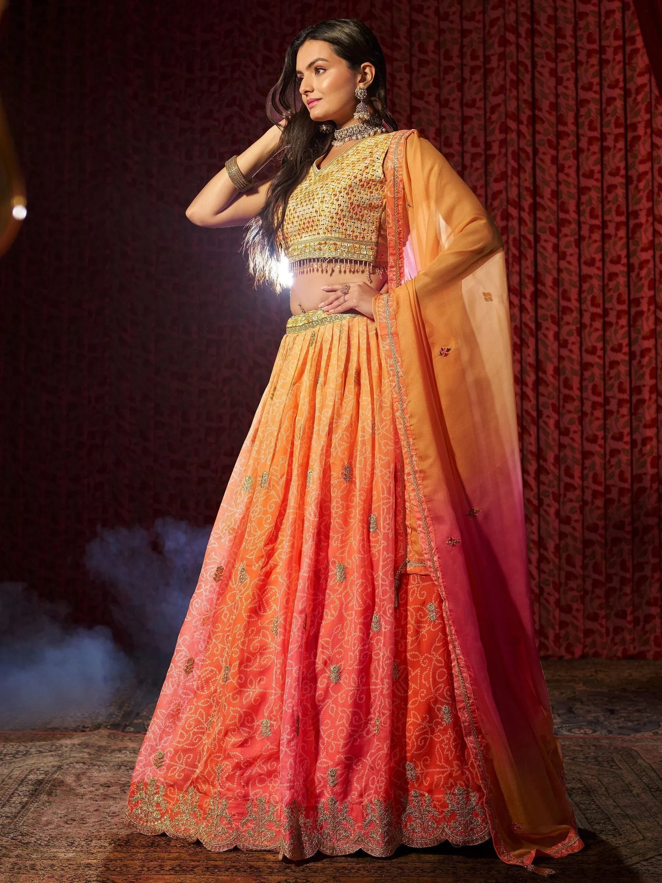 Orange ombre lehenga choli with gold embroidery, perfect for Indian weddings and festive occasions