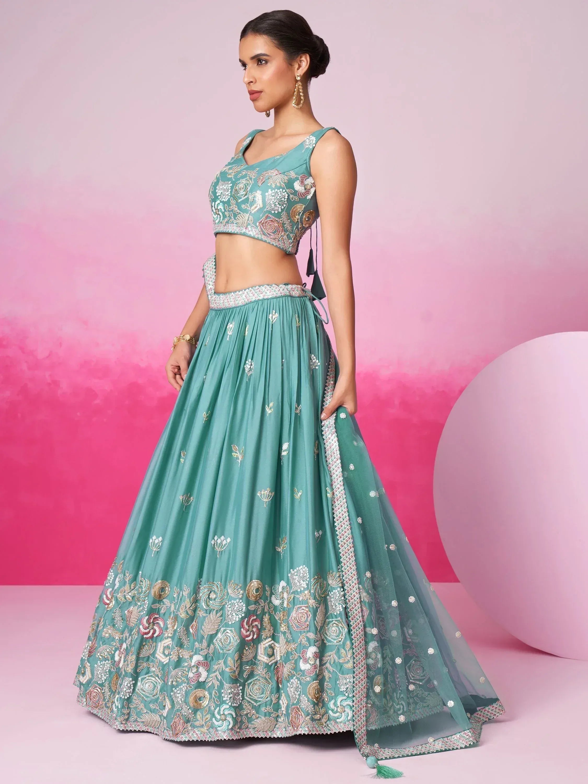 Teal embroidered lehenga choli with floral motifs, perfect for Indian ethnic wear and festive occasions.