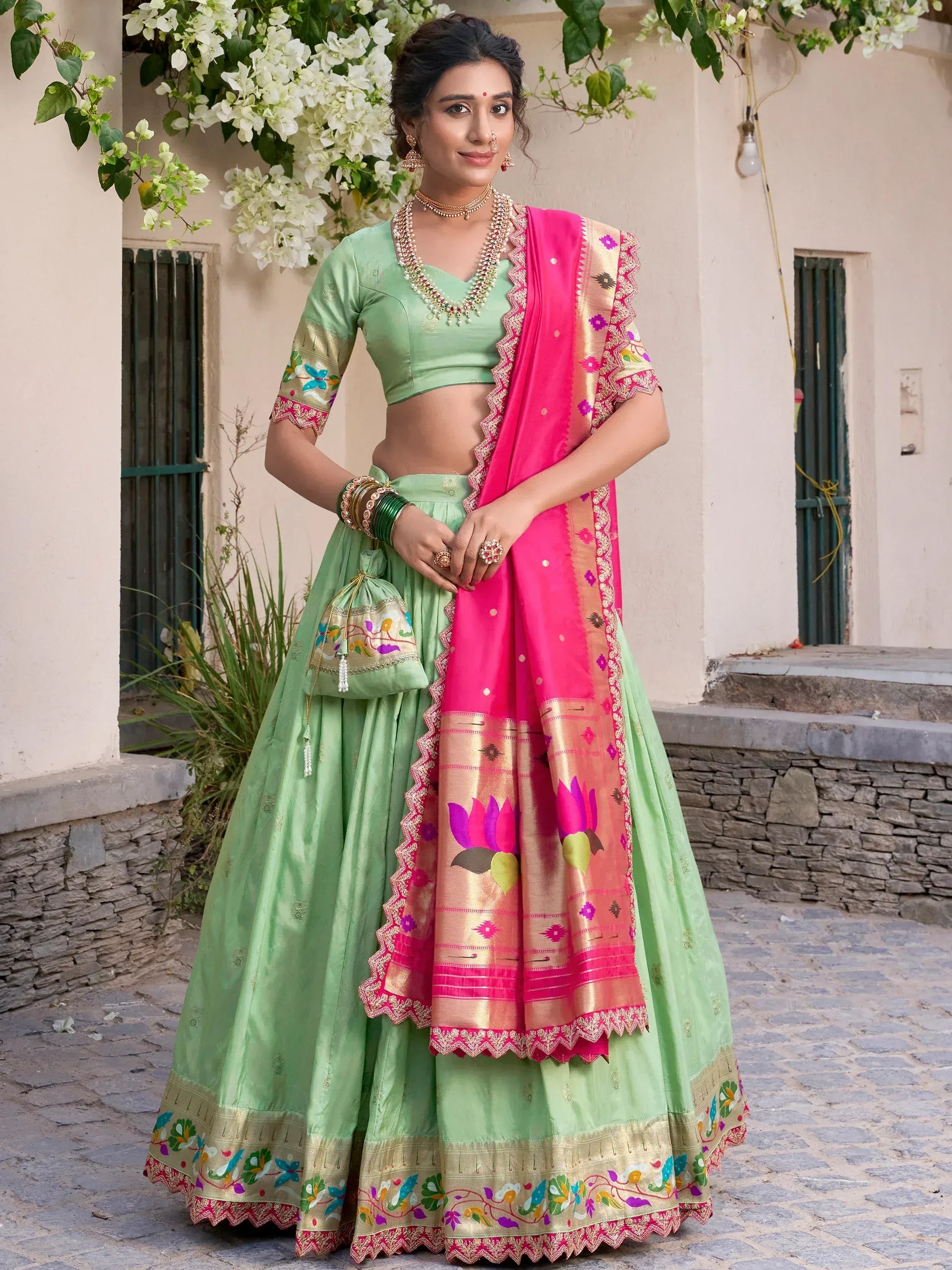 Mint green lehenga choli with pink floral dupatta, perfect for Indian ethnic wear occasions
