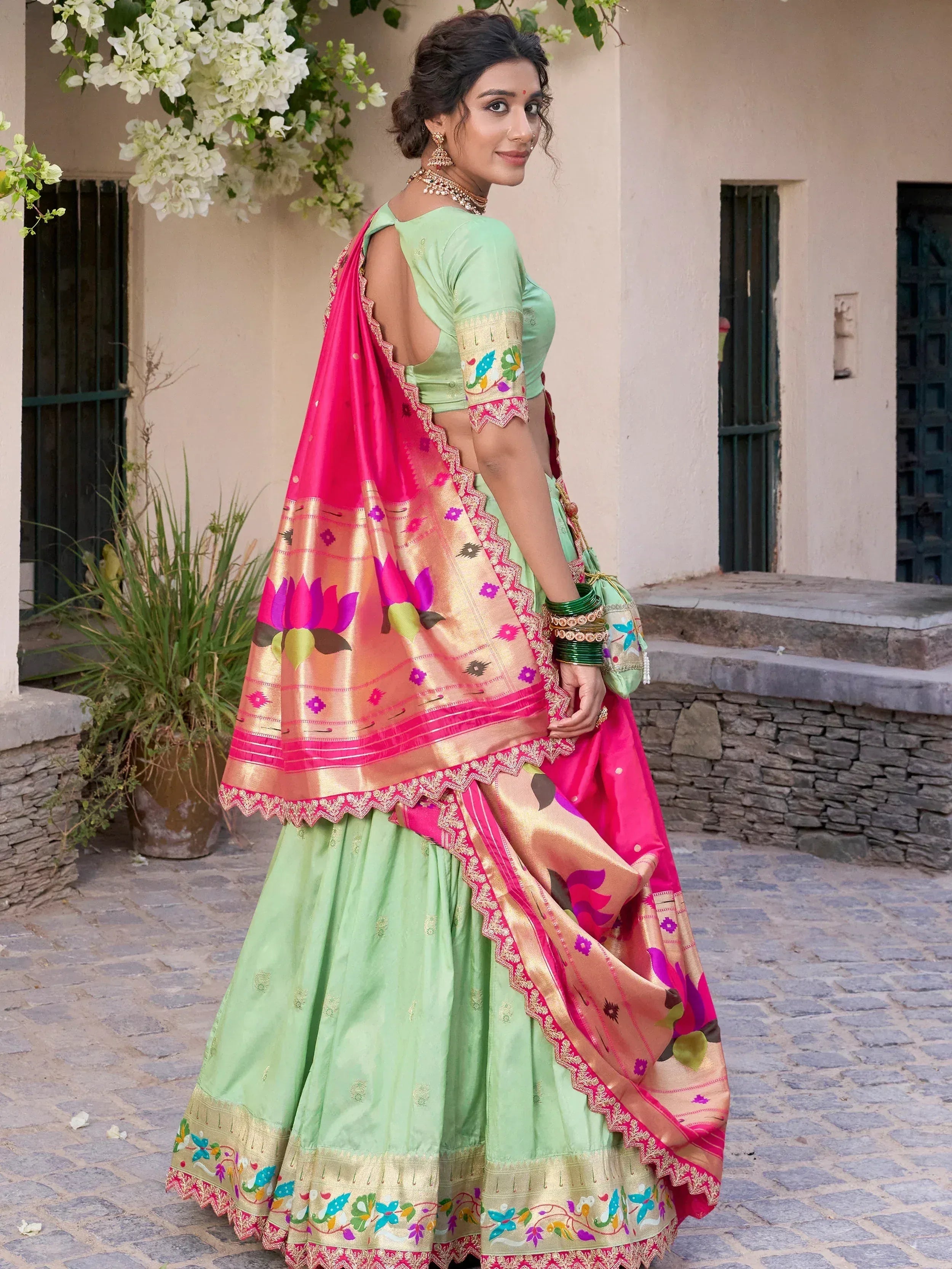 Mint green lehenga choli with pink floral dupatta, perfect for Indian ethnic wear occasions