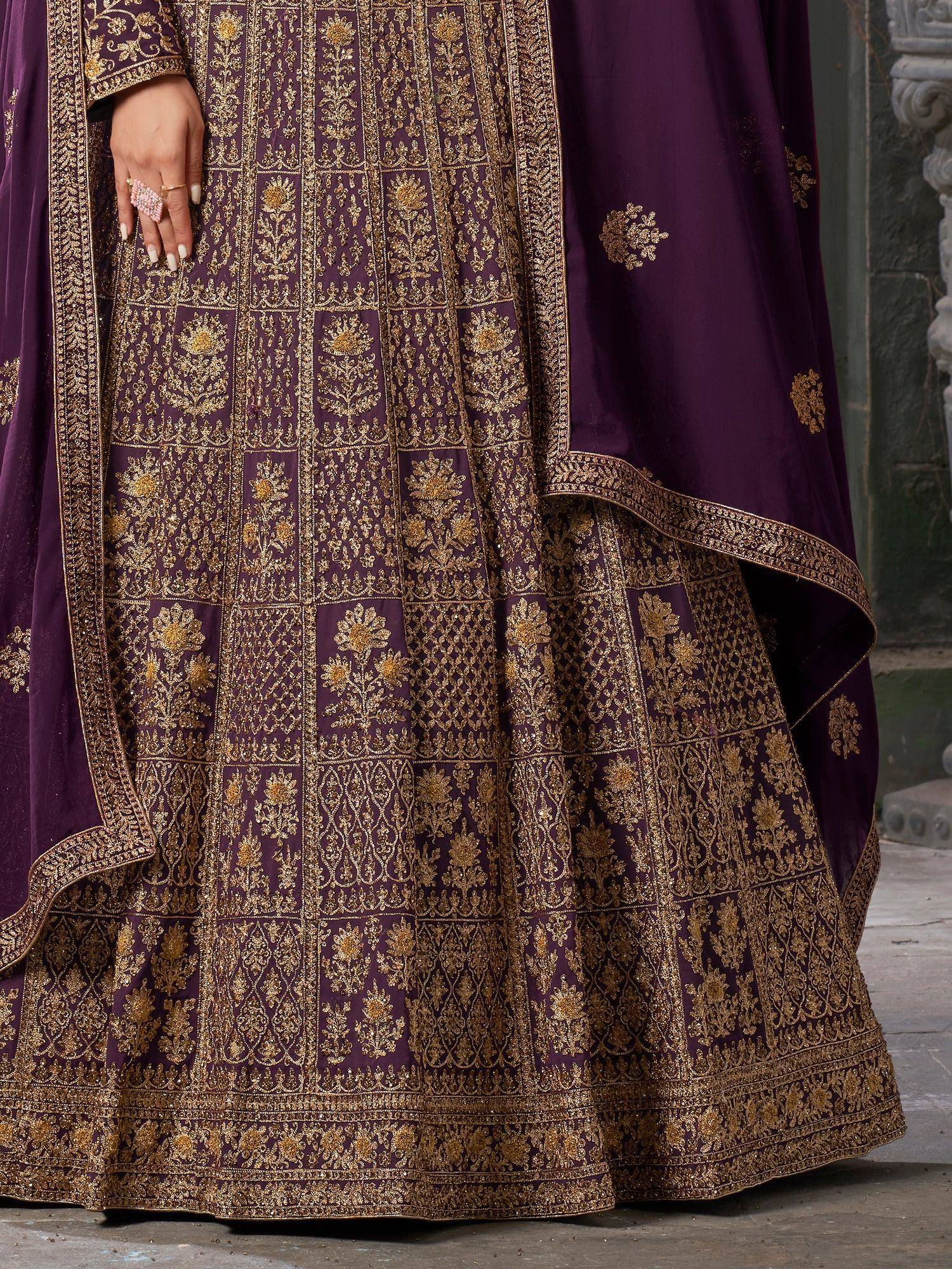 Purple designer lehenga with intricate gold embroidery and floral patterns, perfect for Indian ethnic wear.
