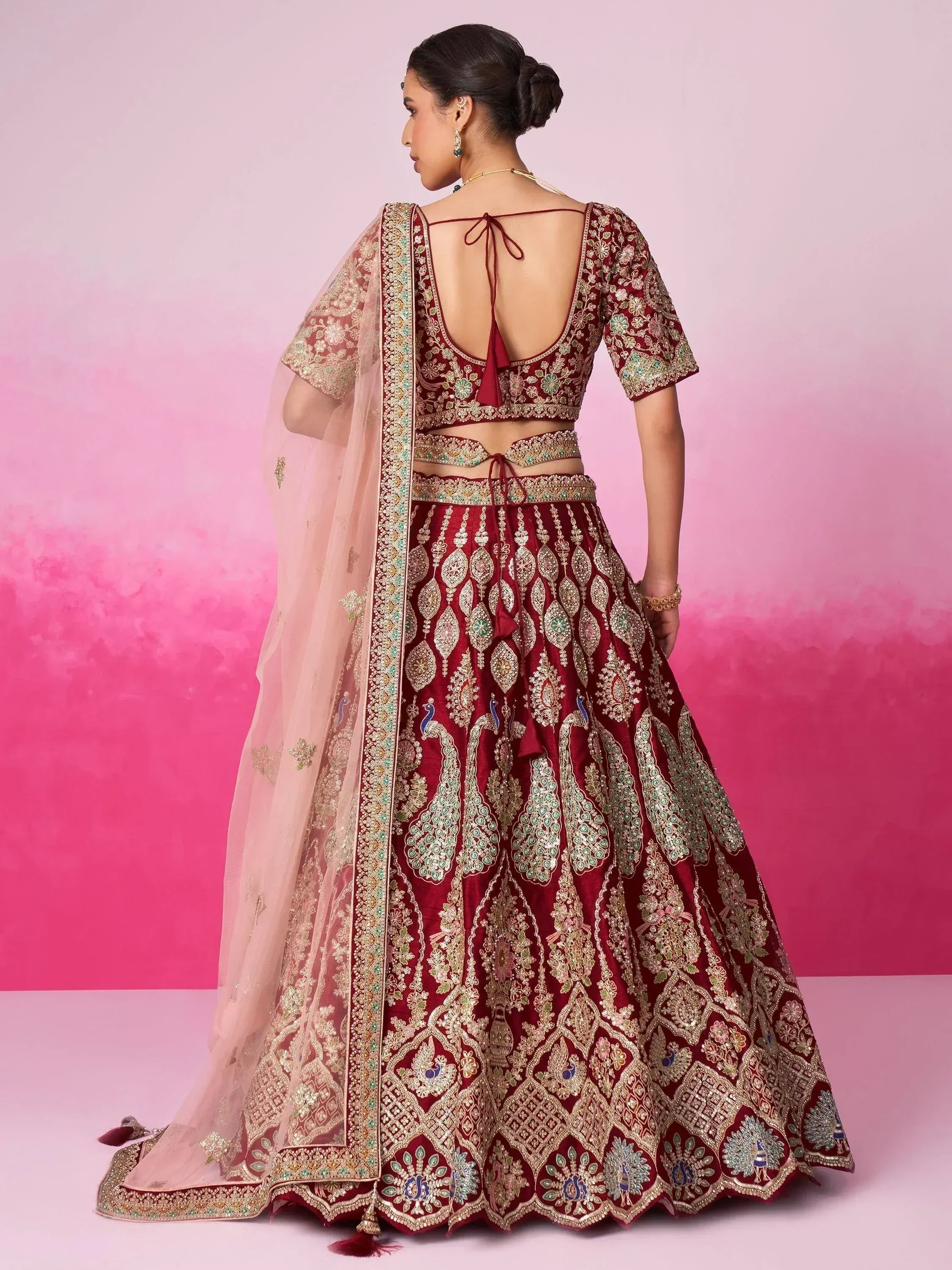 Maroon embroidered lehenga choli with peacock motifs and sheer dupatta, Indian ethnic wear