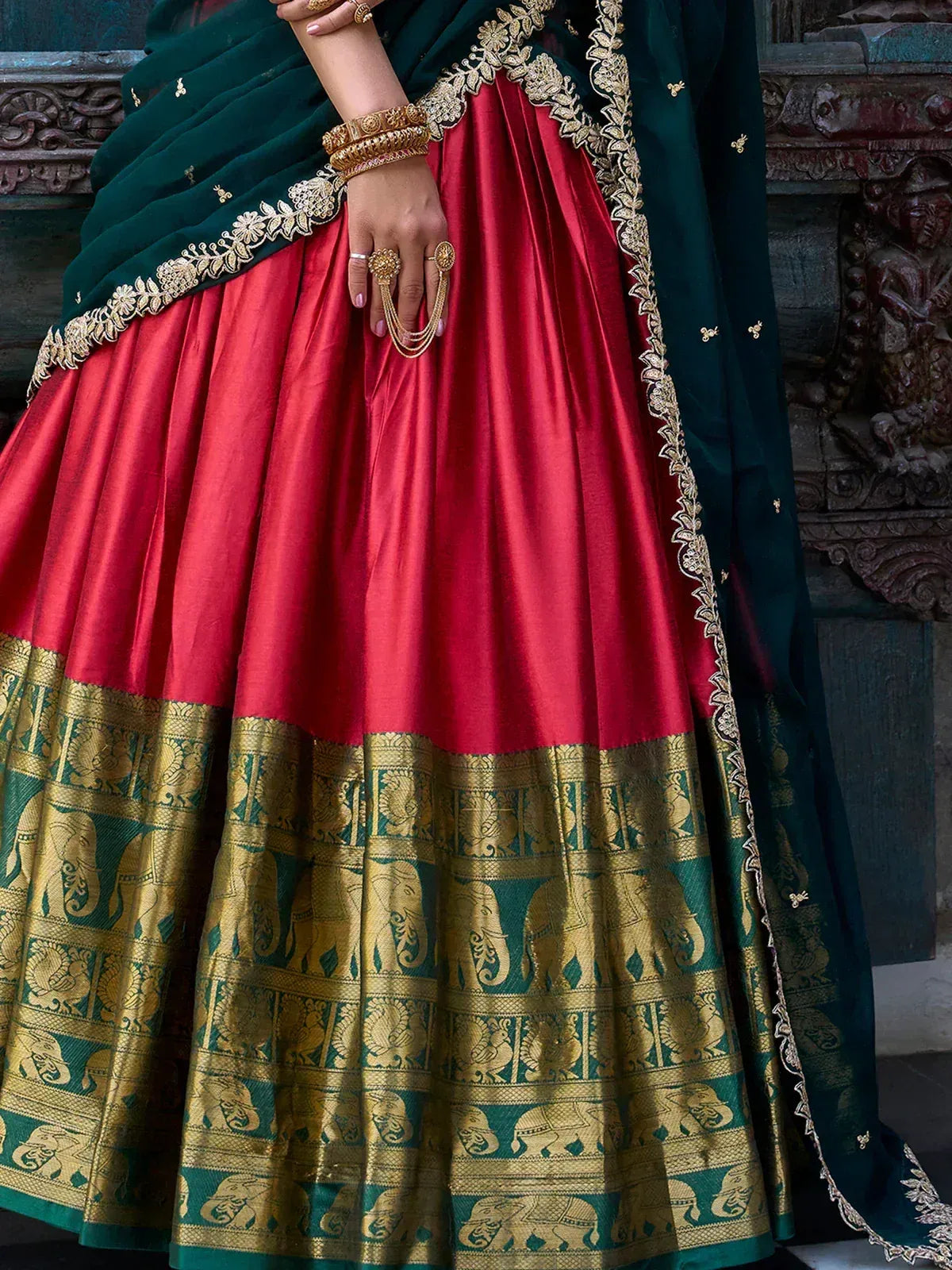 Red and green designer lehenga with gold elephant border and embroidered dupatta