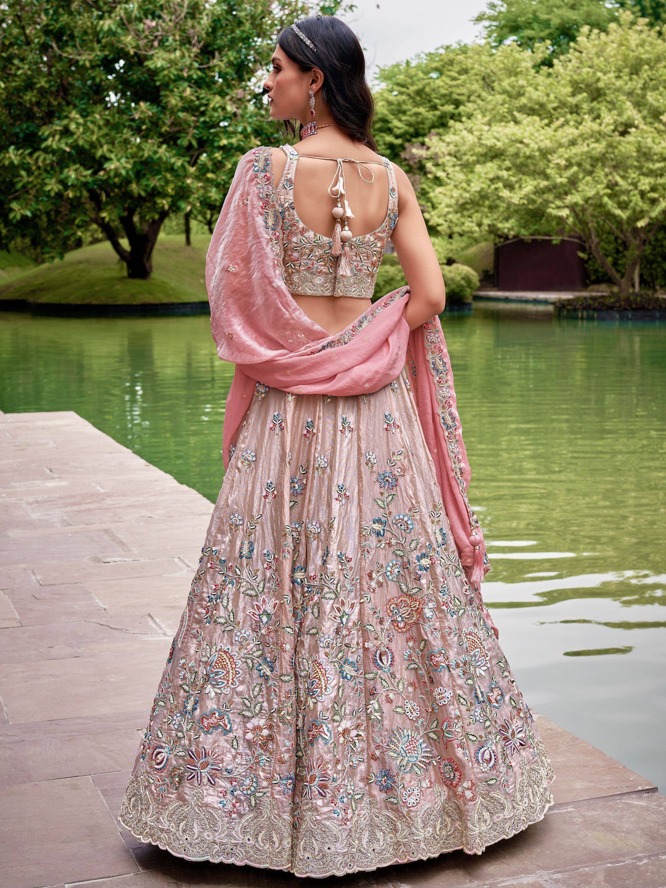 Elegant floral embroidered lehenga choli with pink dupatta, perfect for Indian weddings and festive occasions.
