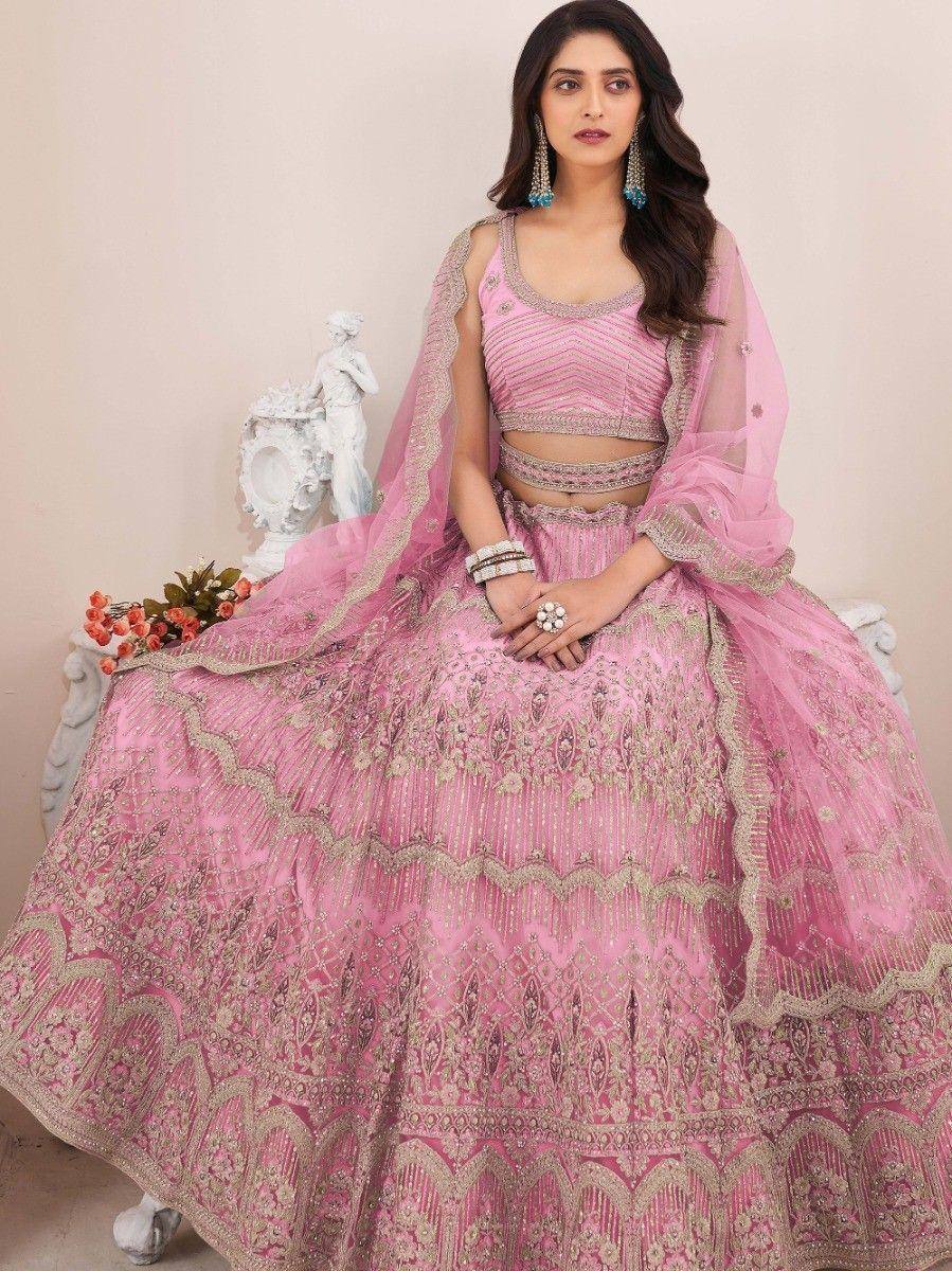 Pink designer lehenga choli with gold embroidery, perfect for Indian weddings and festive occasions