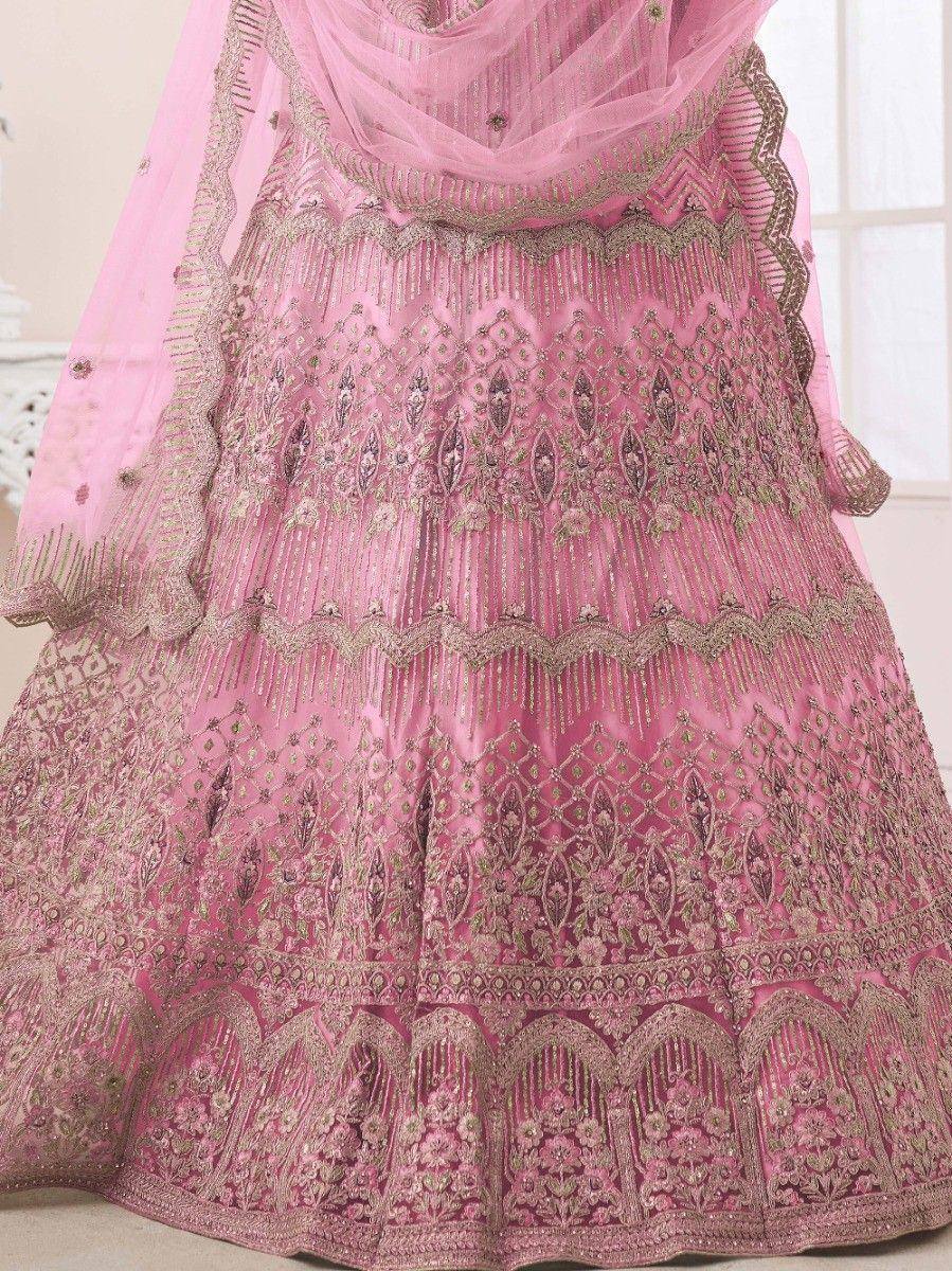 Pink designer lehenga choli with intricate gold embroidery and net dupatta, perfect for Indian weddings