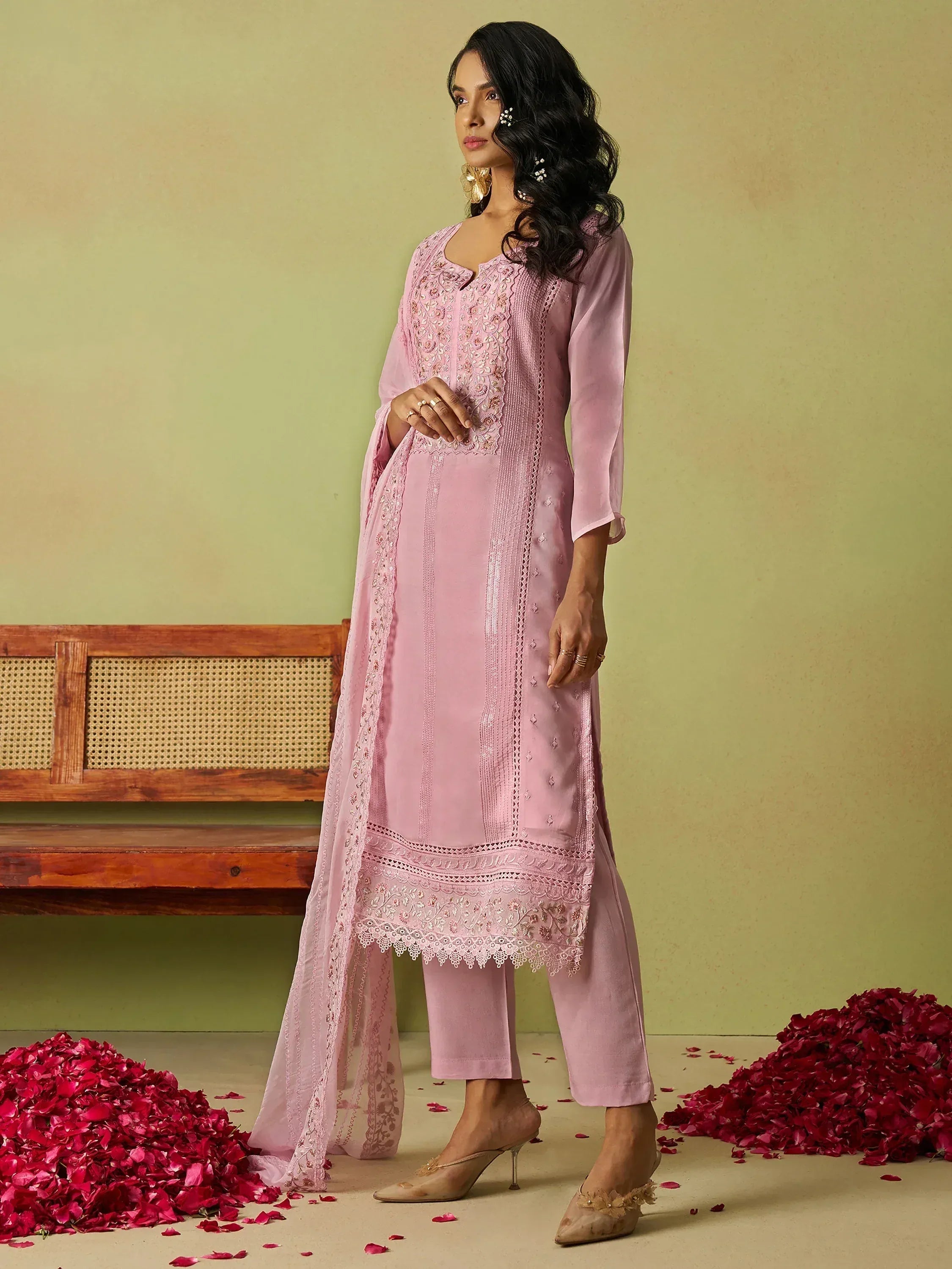 Pink embroidered salwar kameez with lace detailing, perfect for ethnic occasions and festive wear.