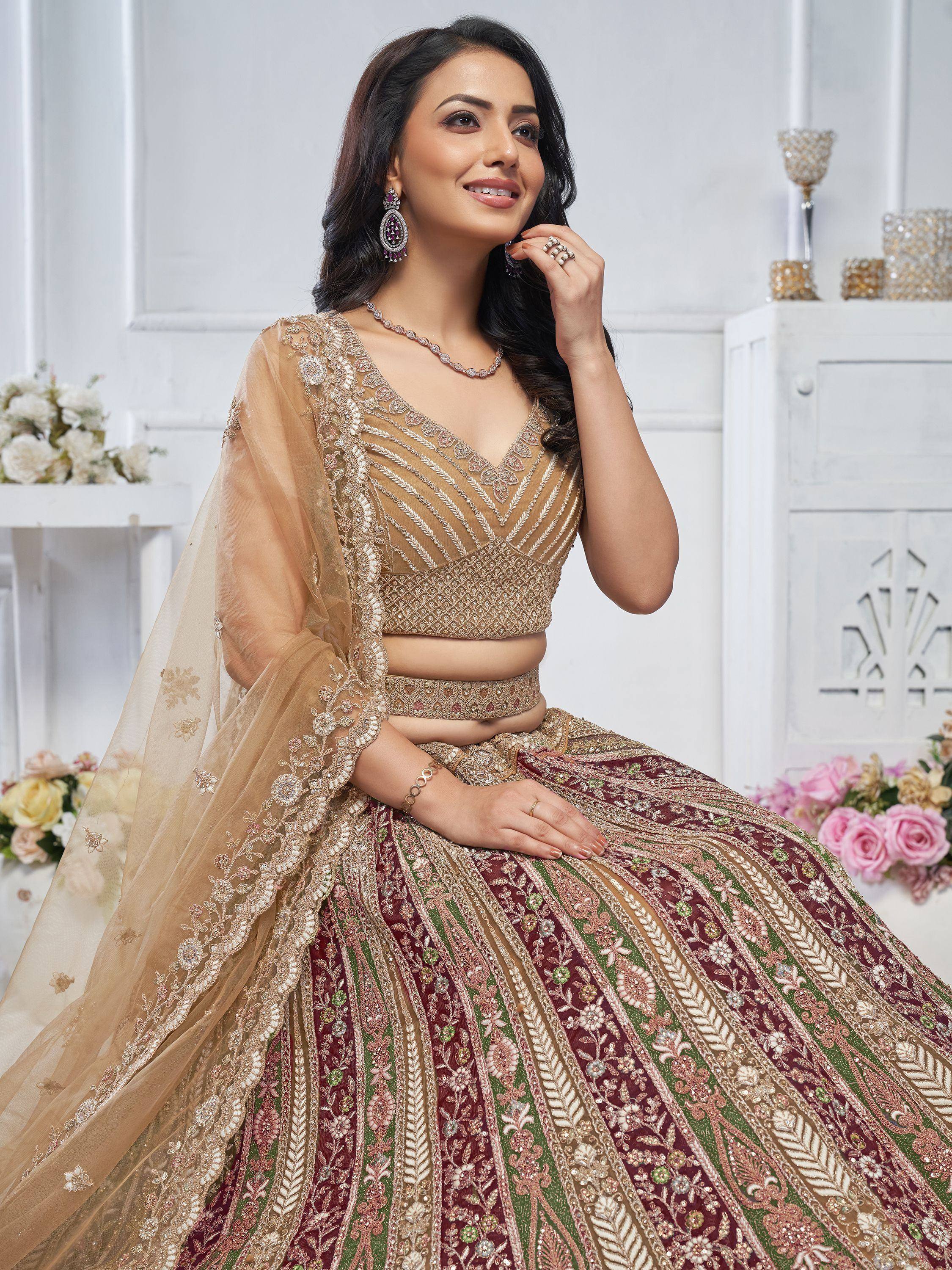Elegant Indian bridal lehenga choli with intricate embroidery and sheer dupatta, perfect for weddings and celebrations.