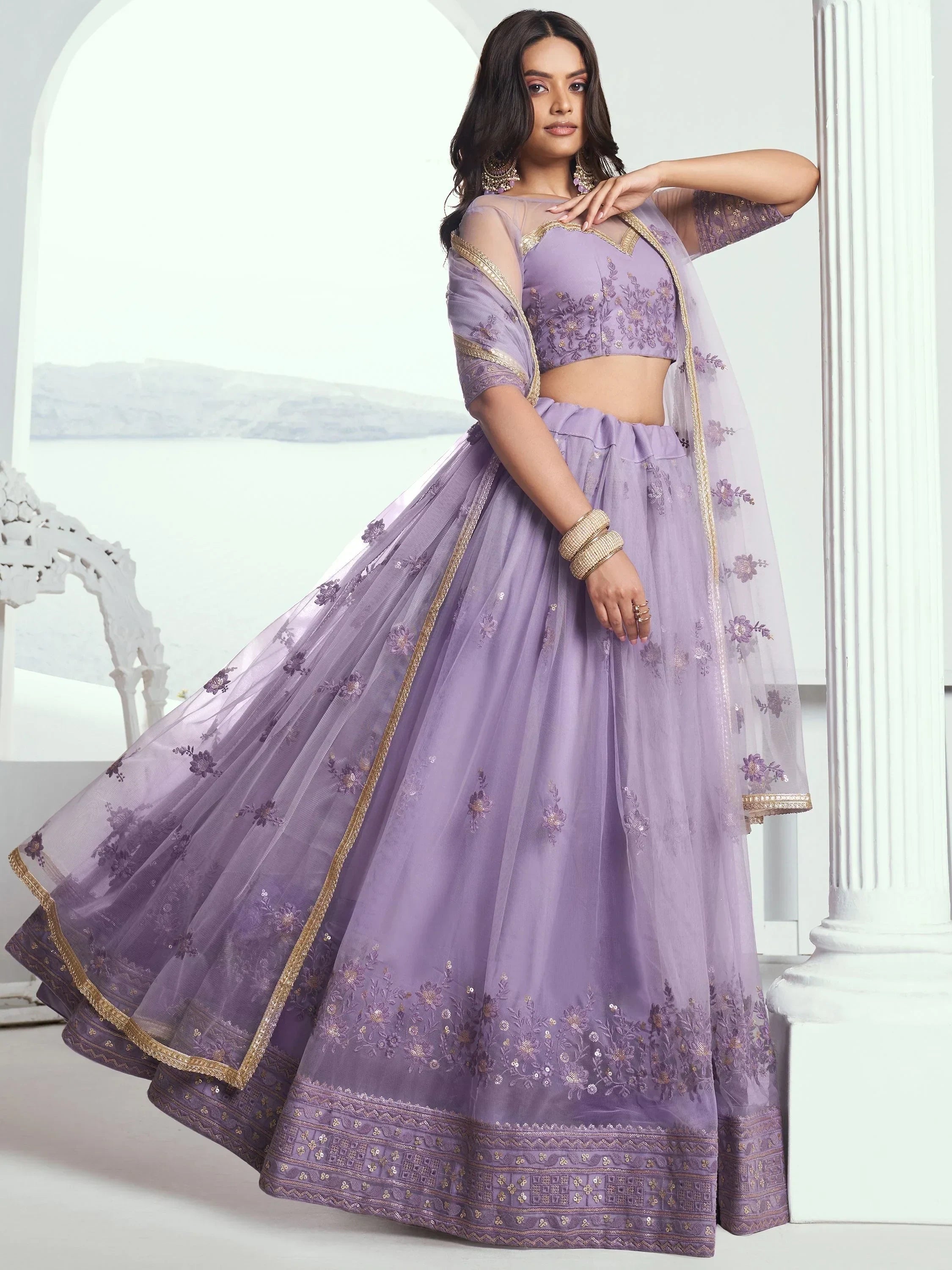 Lavender designer lehenga choli with floral embroidery and gold trim, perfect for Indian ethnic occasions