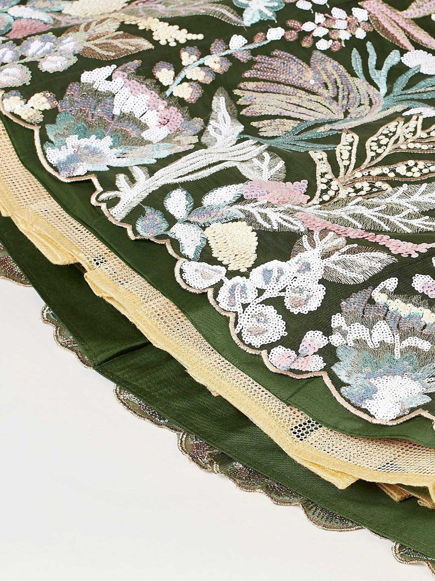 Green ethnic gown with floral embroidery and sequin detailing, featuring gold lace trim.