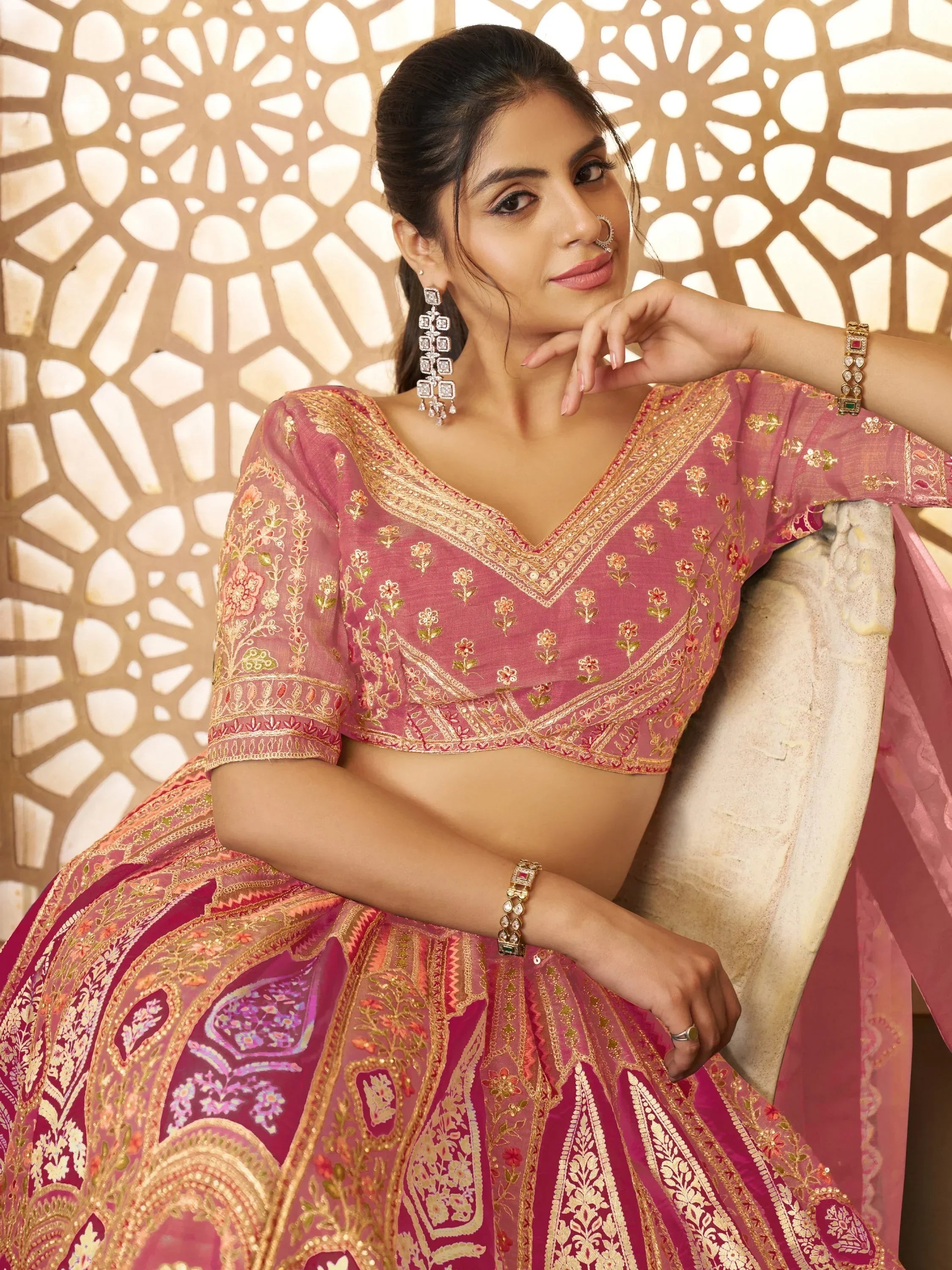 Pink embroidered lehenga choli with gold detailing, perfect for Indian ethnic wear and festive occasions