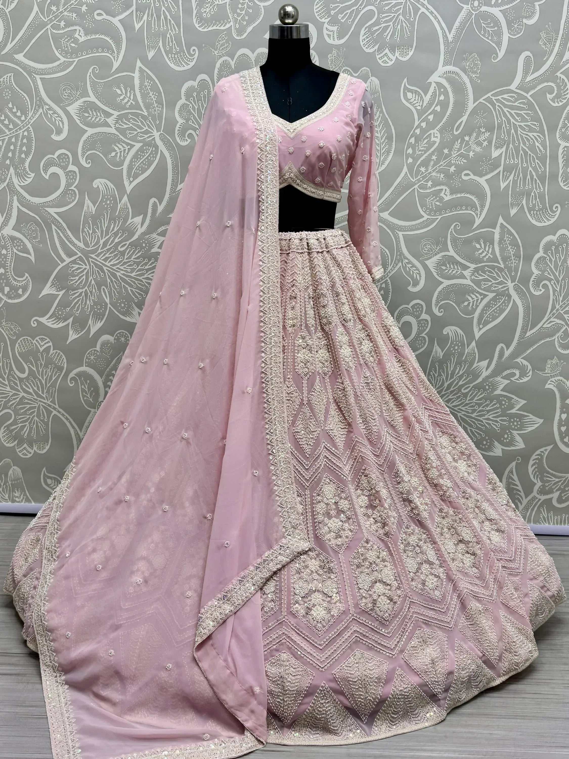 Pink designer lehenga choli with heavy embroidery and dupatta, ethnic Indian wear for weddings