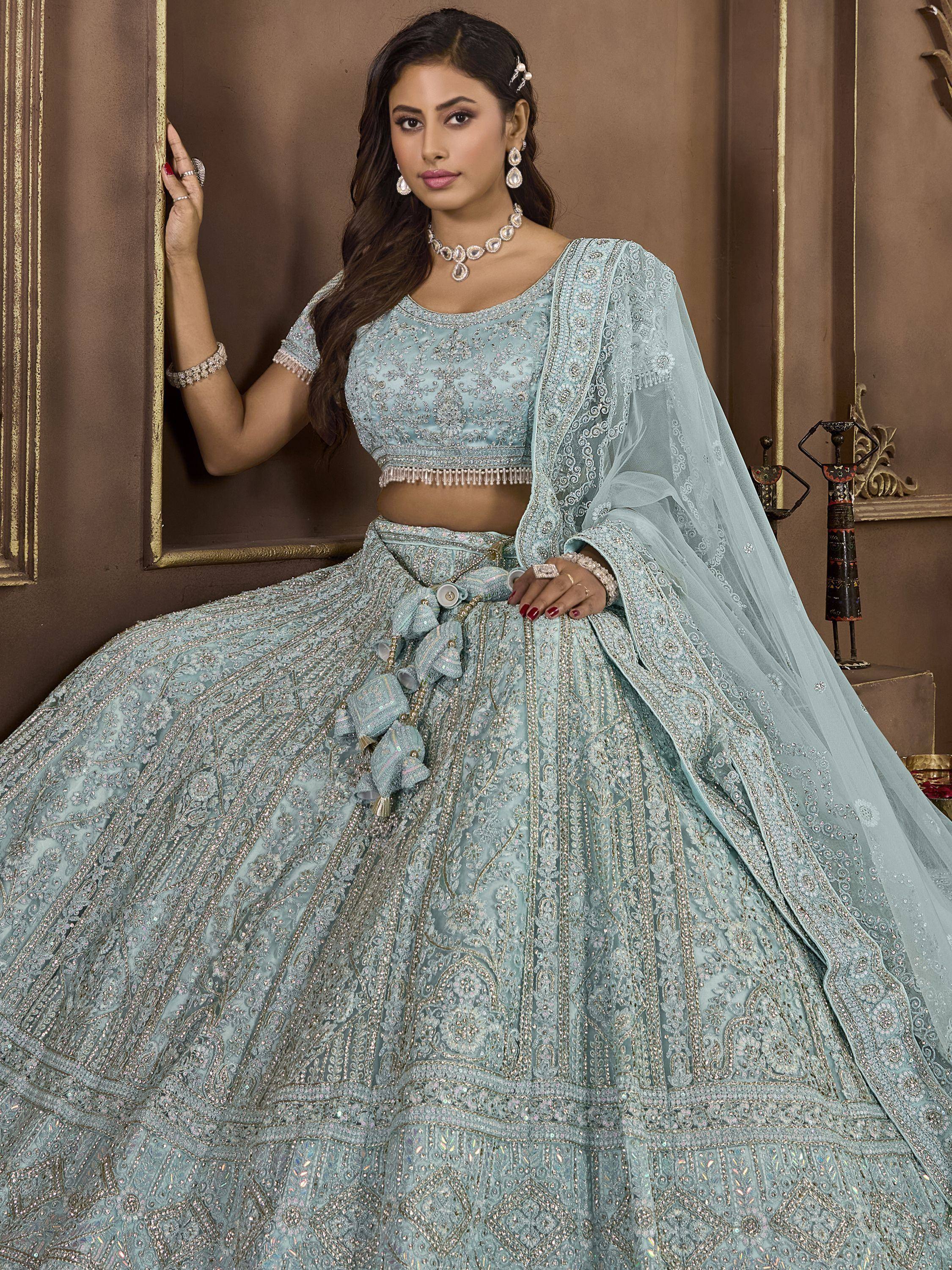 Light blue designer lehenga choli with heavy embroidery and dupatta, perfect for weddings and festive occasions