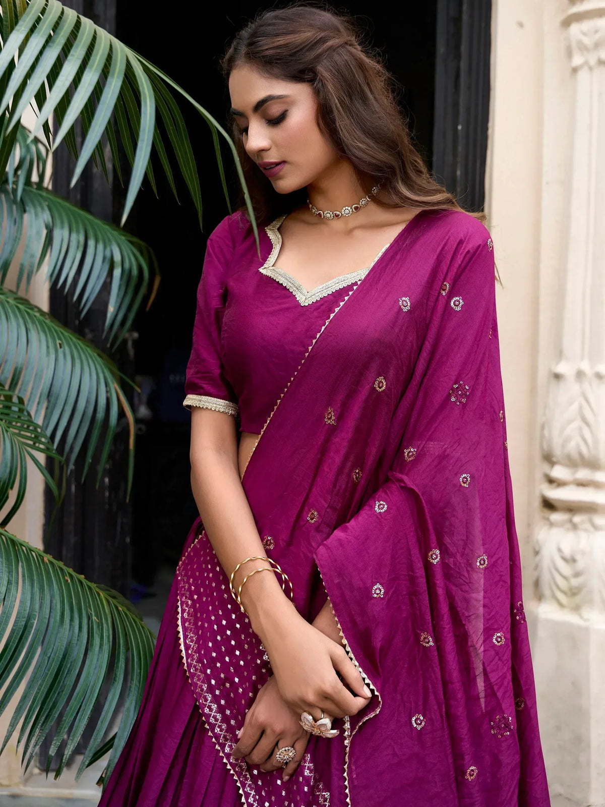 Elegant purple ethnic lehenga choli with gold embroidery, perfect for Indian weddings and festive occasions.