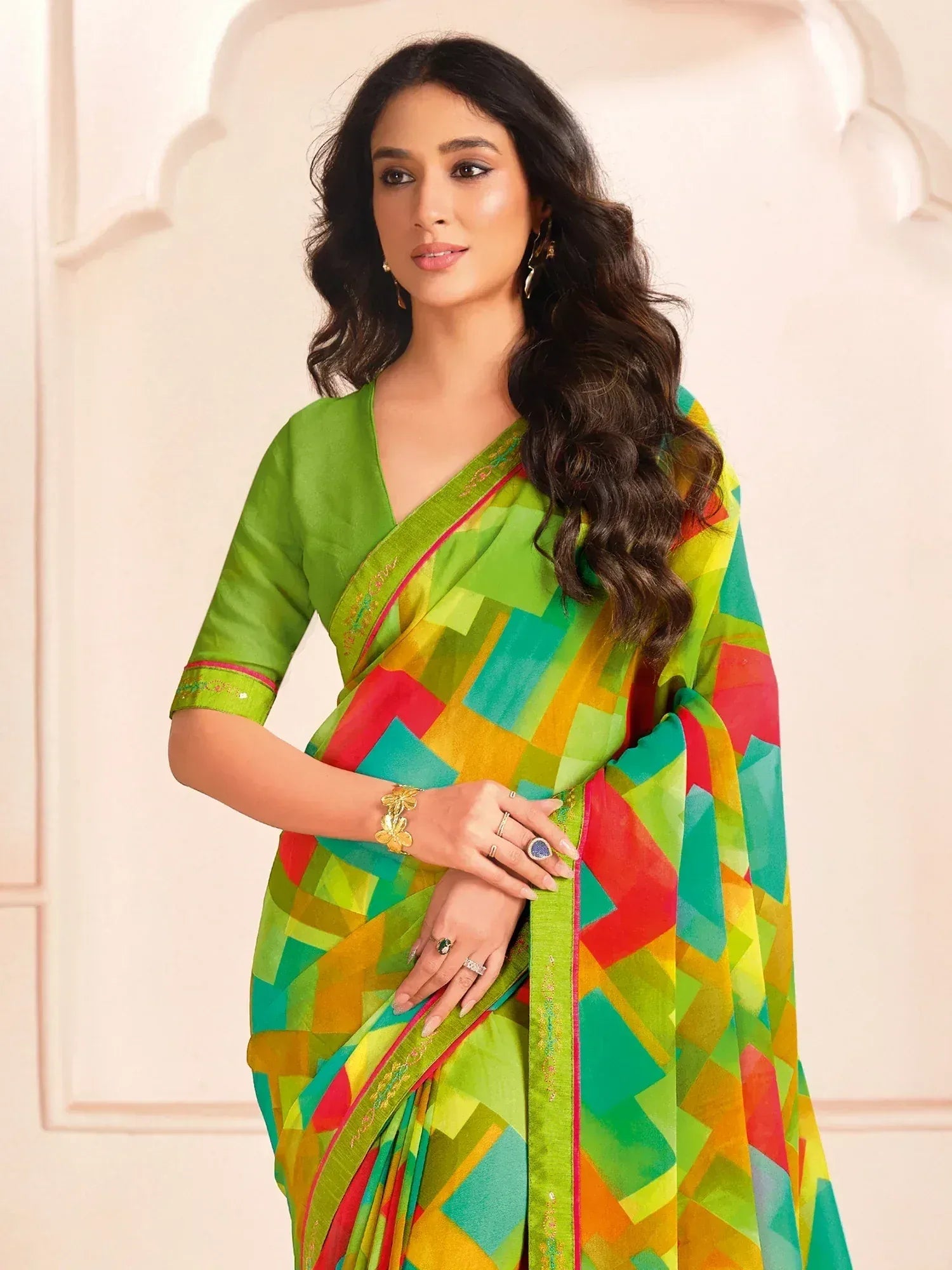 Vibrant green saree with colorful geometric print, perfect for ethnic occasions and festive wear.