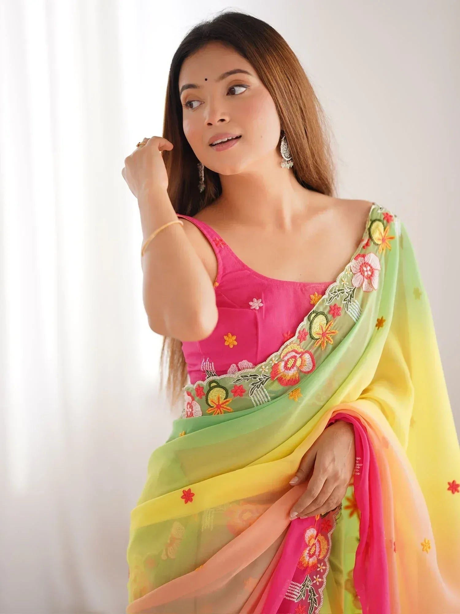 Vibrant floral embroidered saree with pink blouse, perfect for ethnic occasions