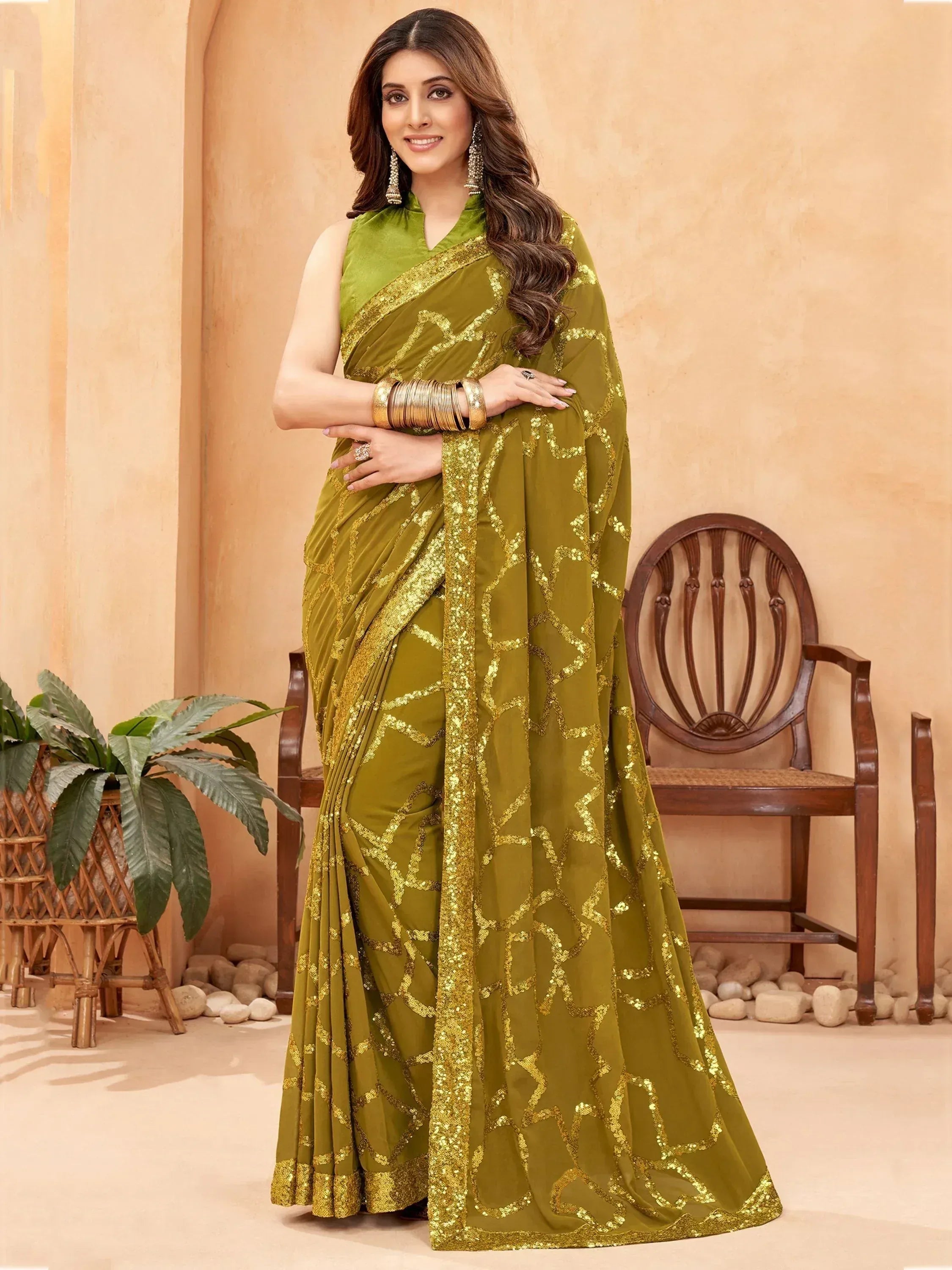 Olive green saree with gold sequin embroidery, perfect for Indian ethnic wear occasions.