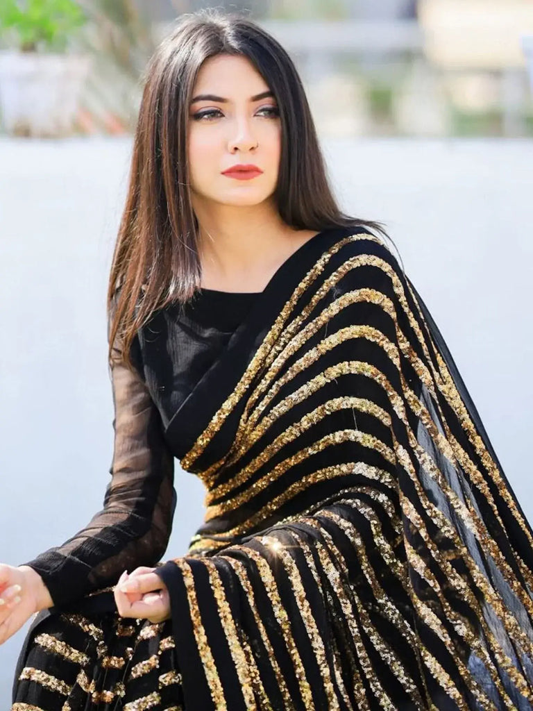 Charming Black Georgette Striped Reception Wear Saree With Blouse