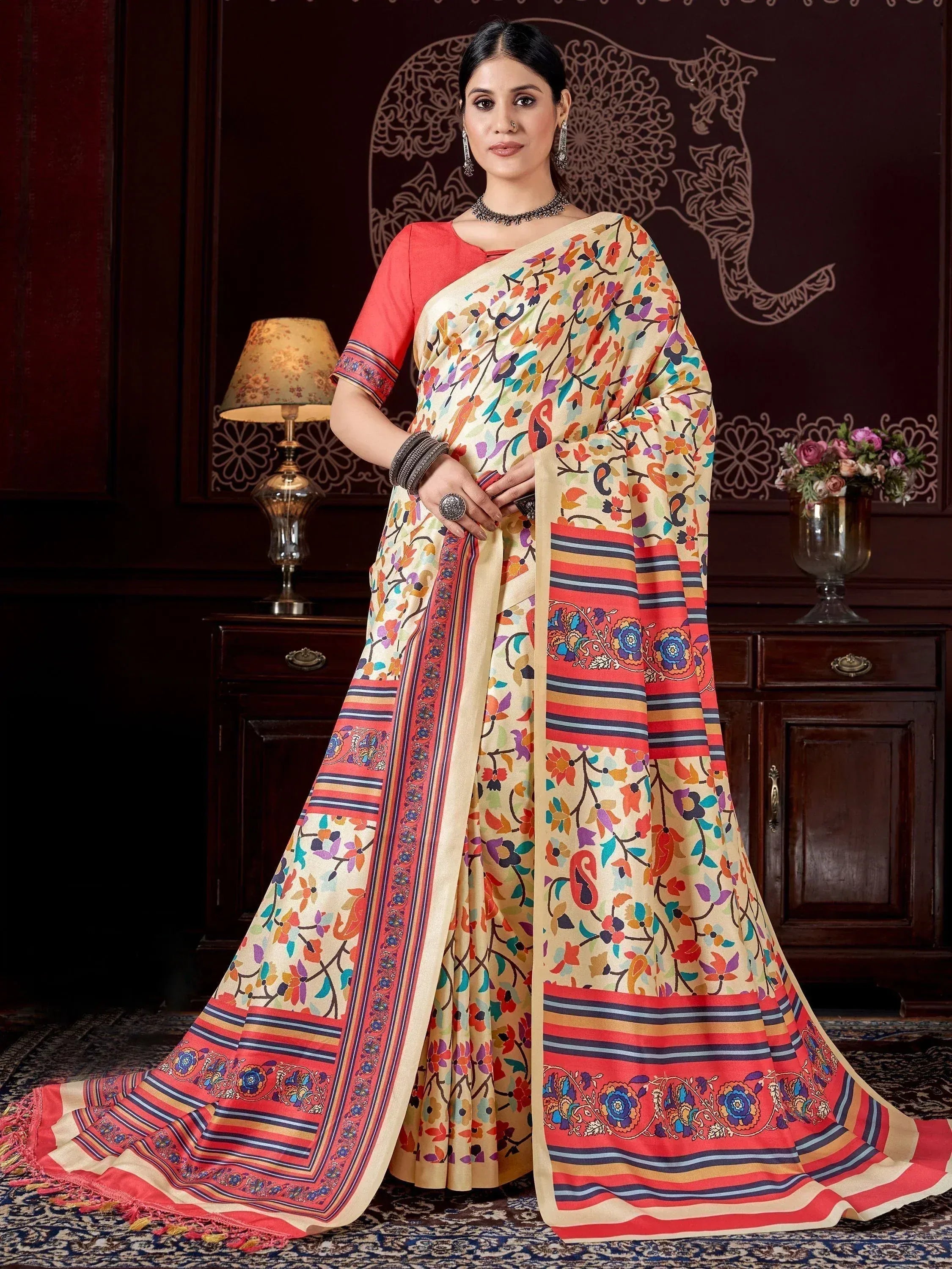 Woman in colorful floral print saree with red blouse, ethnic Indian wear for festive occasions