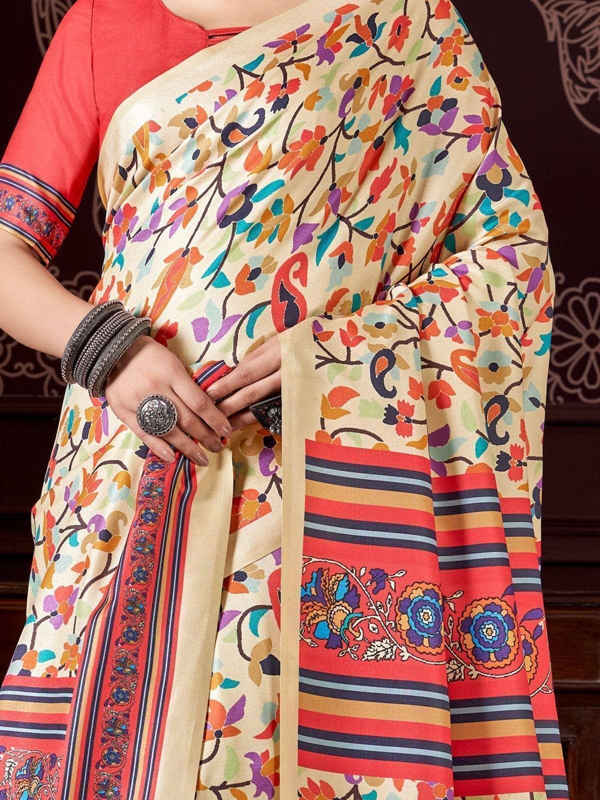 Colorful floral print saree with striped border, paired with red blouse, ethnic Indian wear