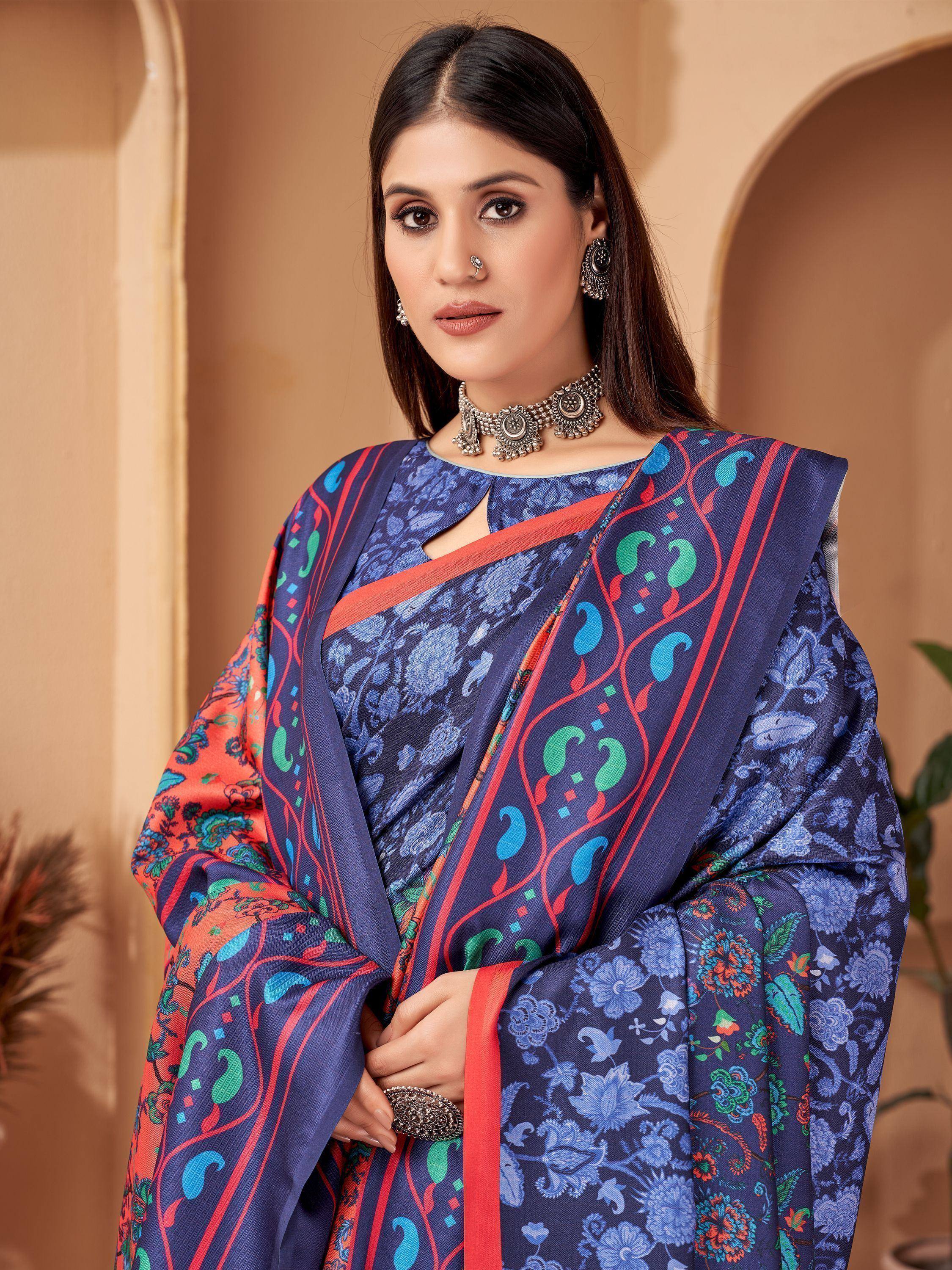 Woman in blue floral printed saree with red border and ethnic jewelry, stylish Indian ethnic wear