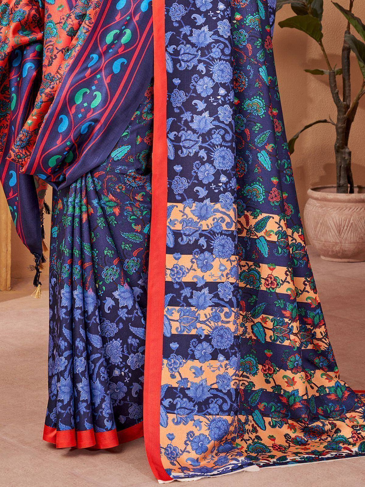 Vibrant floral printed saree with blue, orange, and green patterns, perfect for ethnic wear occasions
