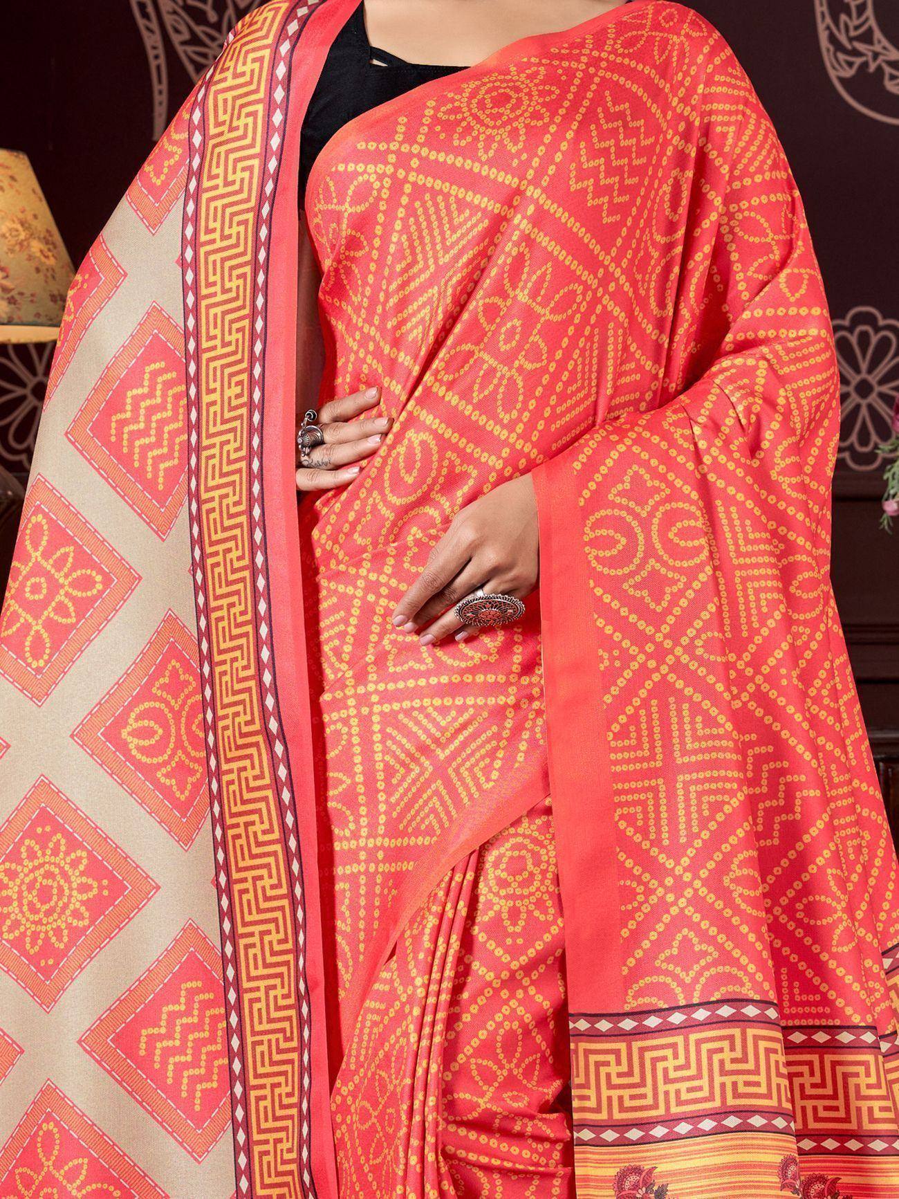 Vibrant coral saree with yellow geometric print and border, ethnic Indian wear