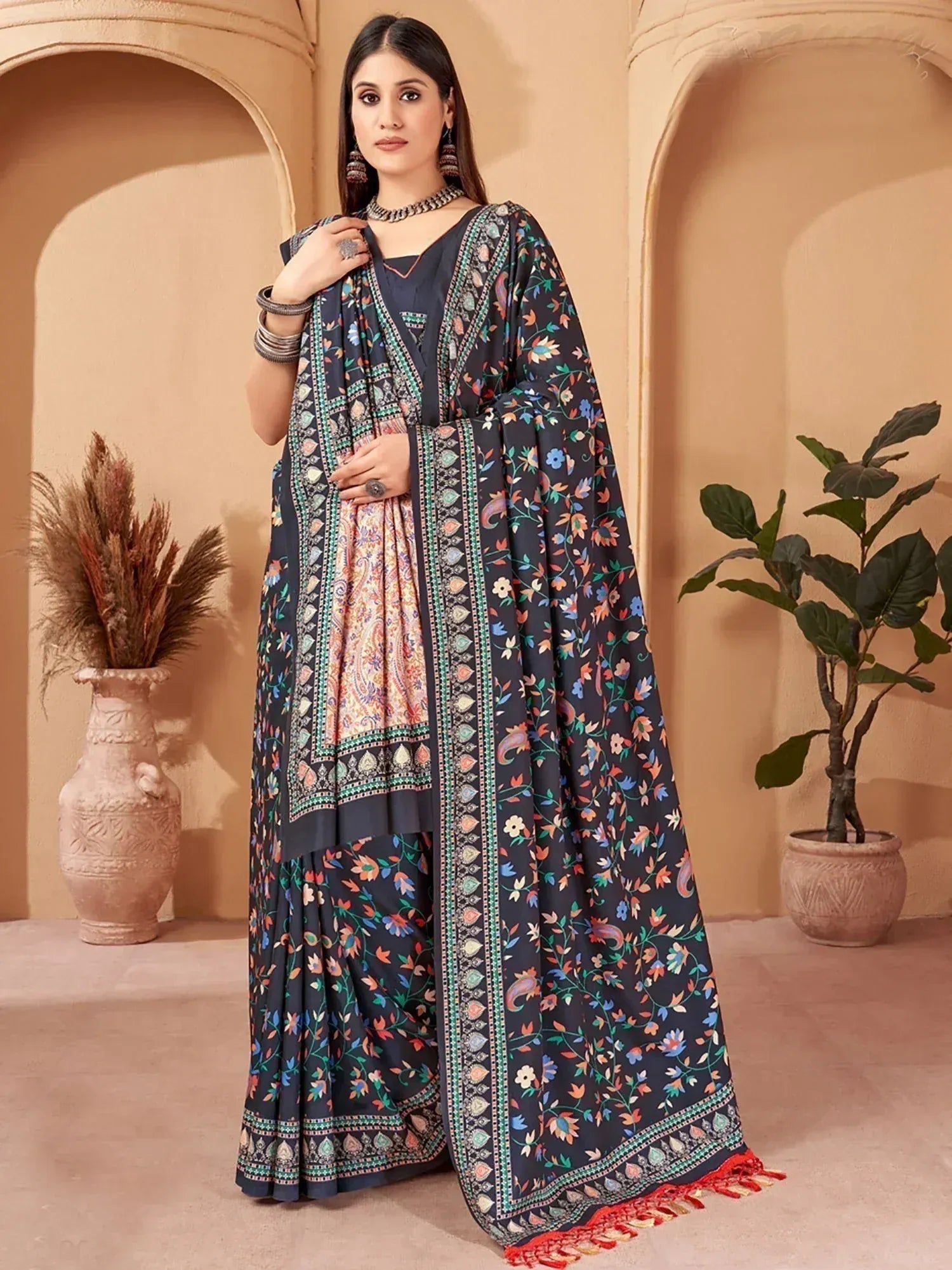Woman in navy floral print salwar kameez with embroidered dupatta, ethnic Indian wear