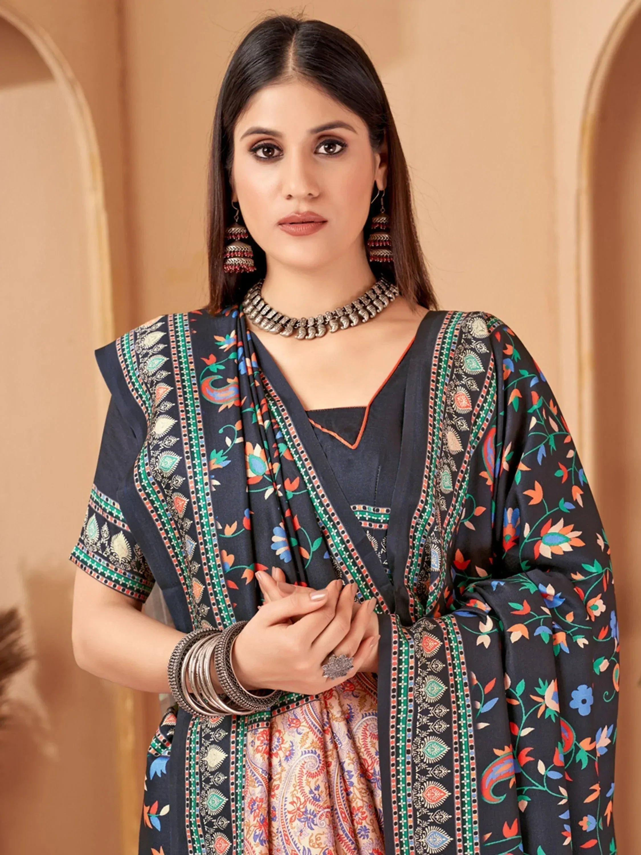 Woman in navy floral print salwar kameez with ethnic jewelry, Indian ethnic wear