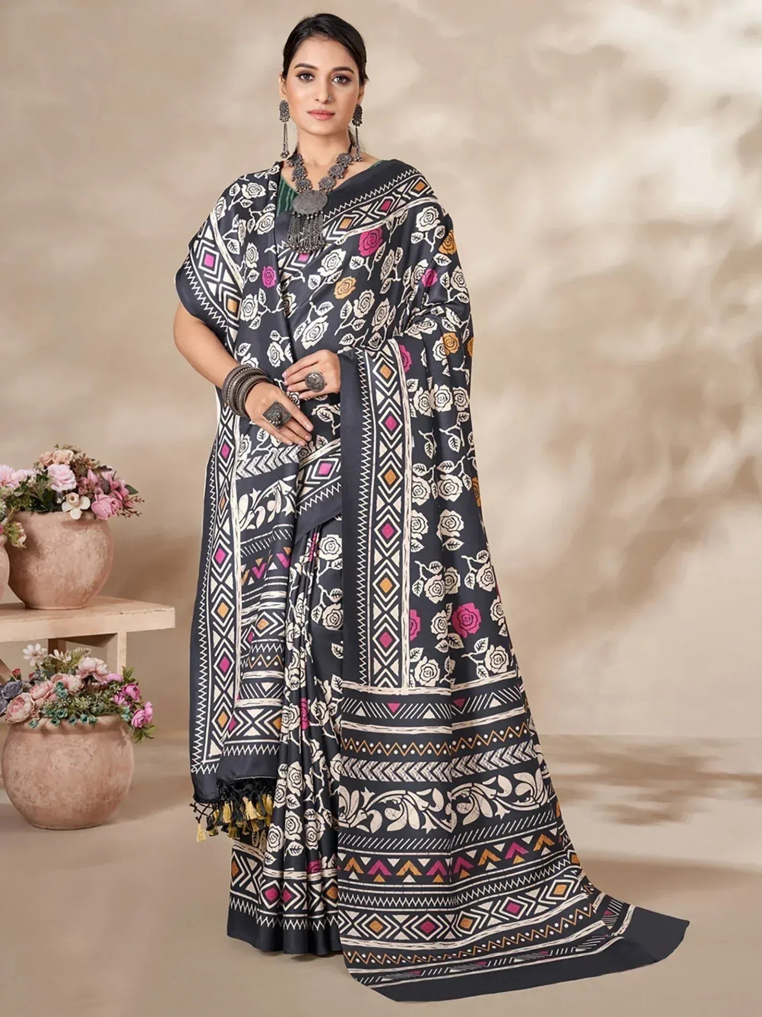 Black floral and geometric print saree with ethnic jewelry, perfect for Indian ethnic wear occasions