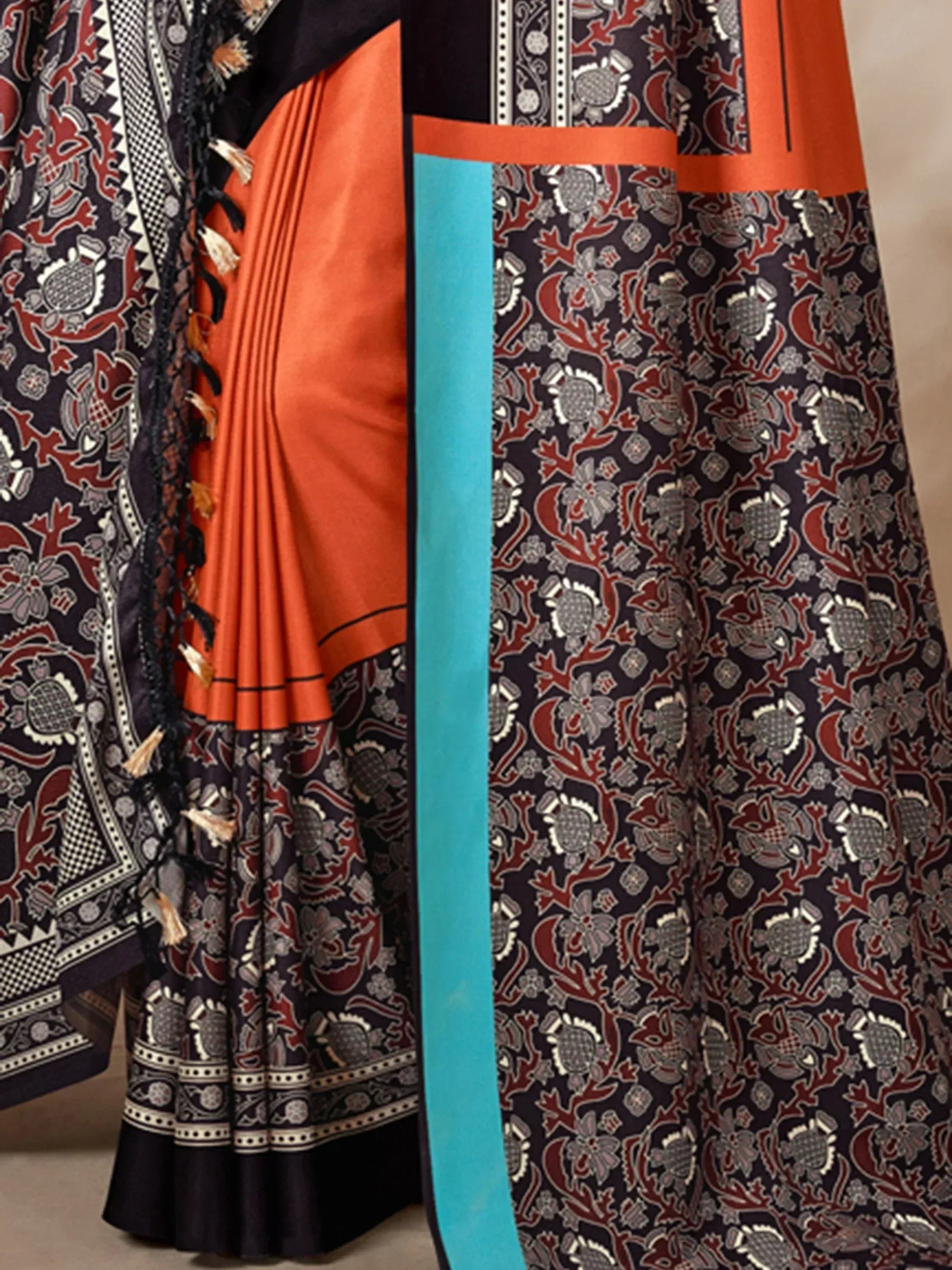 Orange and navy printed saree with tassel border, ethnic Indian wear