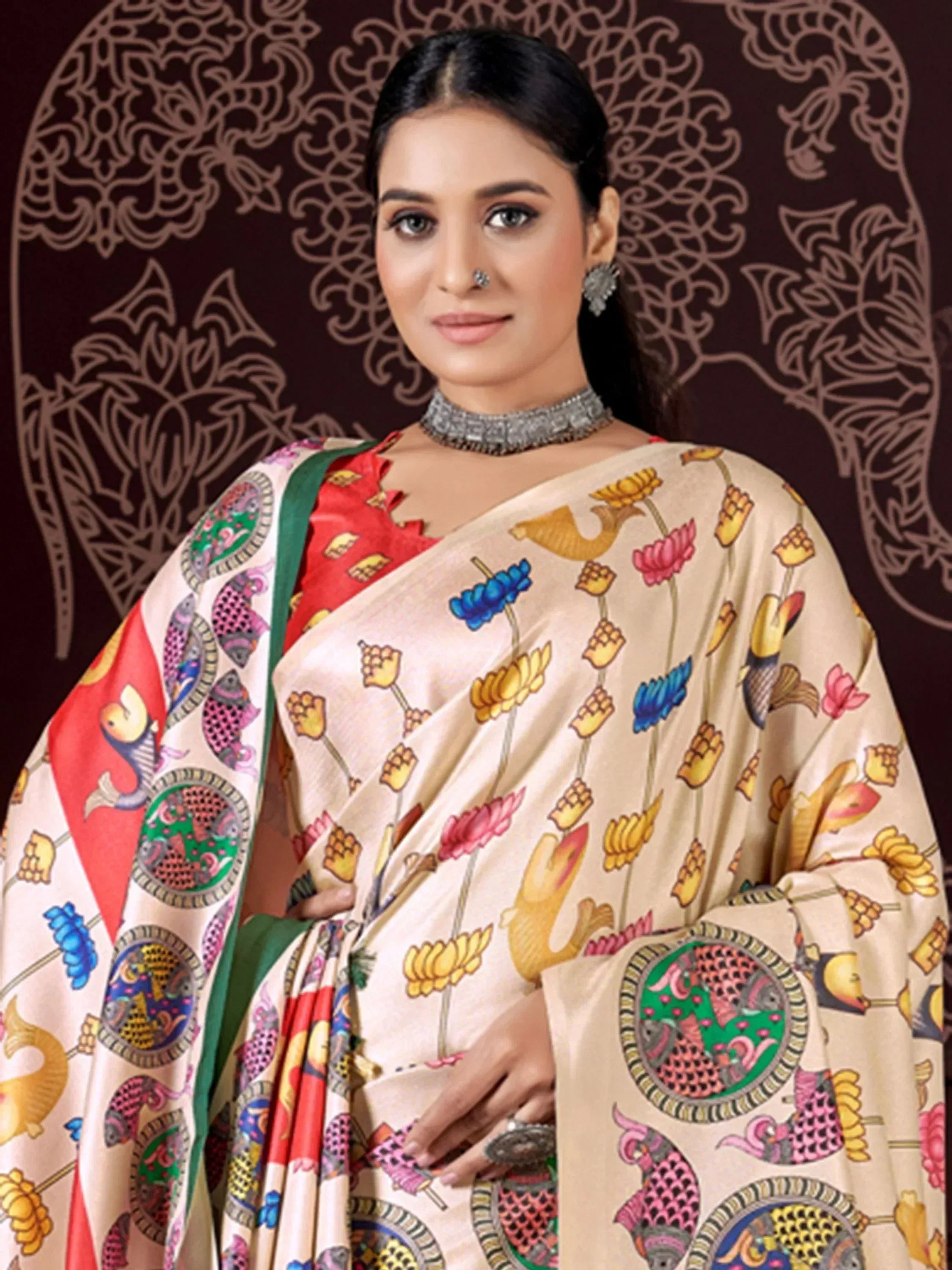 Woman in colorful printed saree with floral and fish motifs, traditional Indian ethnic wear