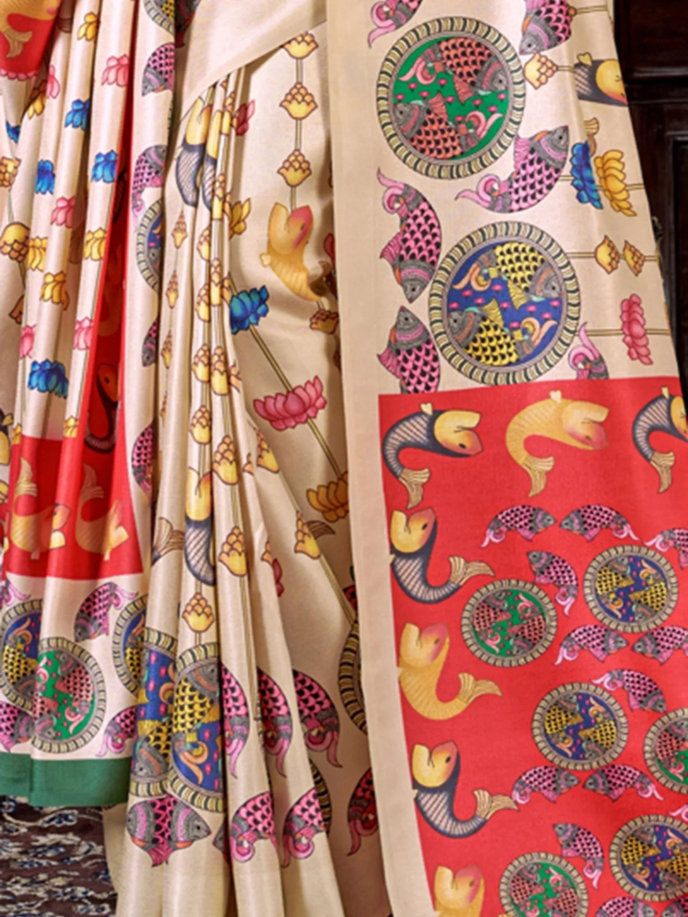 Vibrant fish and floral patterned saree with colorful circular motifs, ideal for ethnic wear.