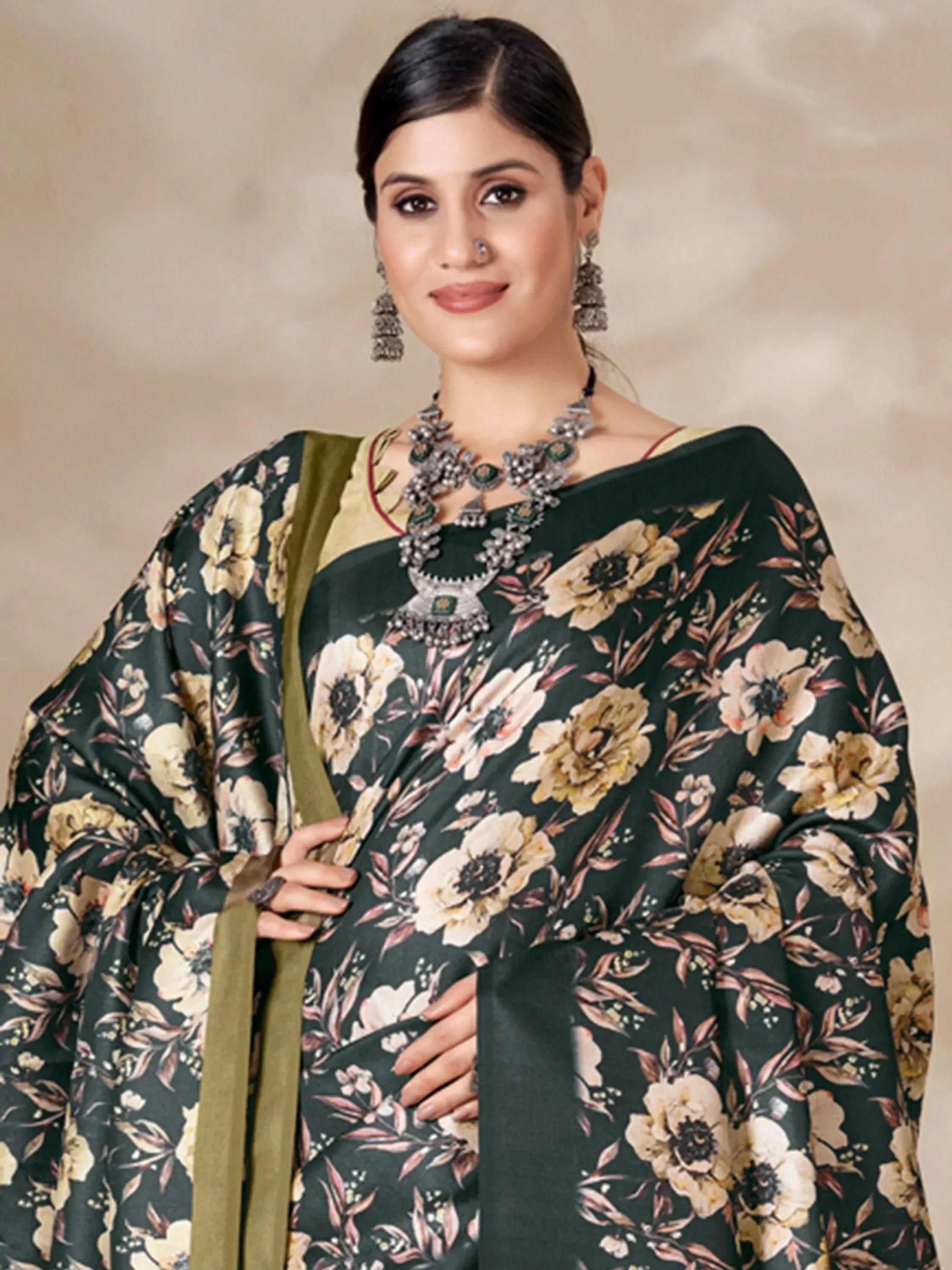 Woman in elegant floral print saree with gold blouse, traditional jewelry, perfect for Indian ethnic occasions.
