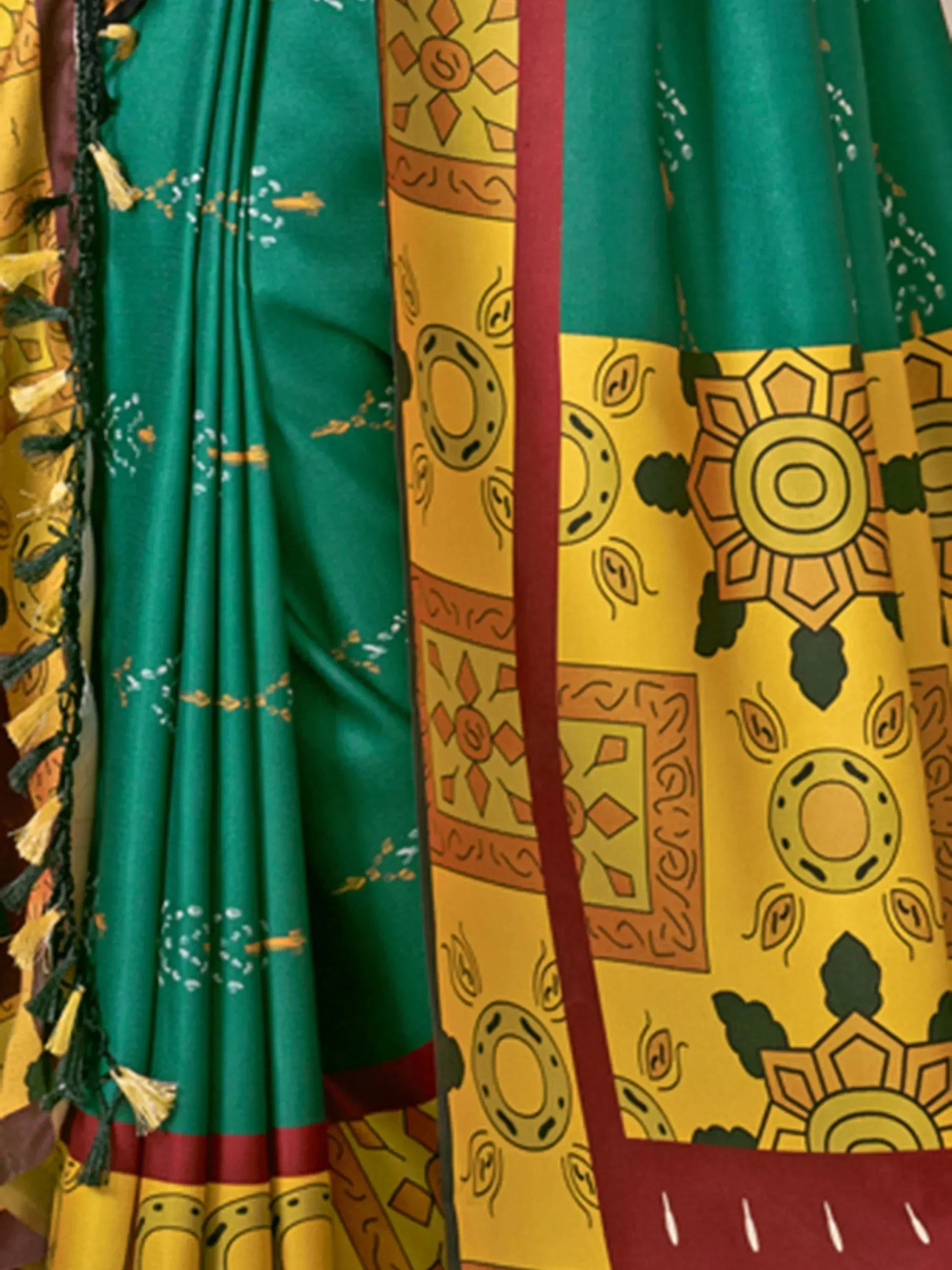 Green and yellow ethnic saree with geometric prints and tassel border