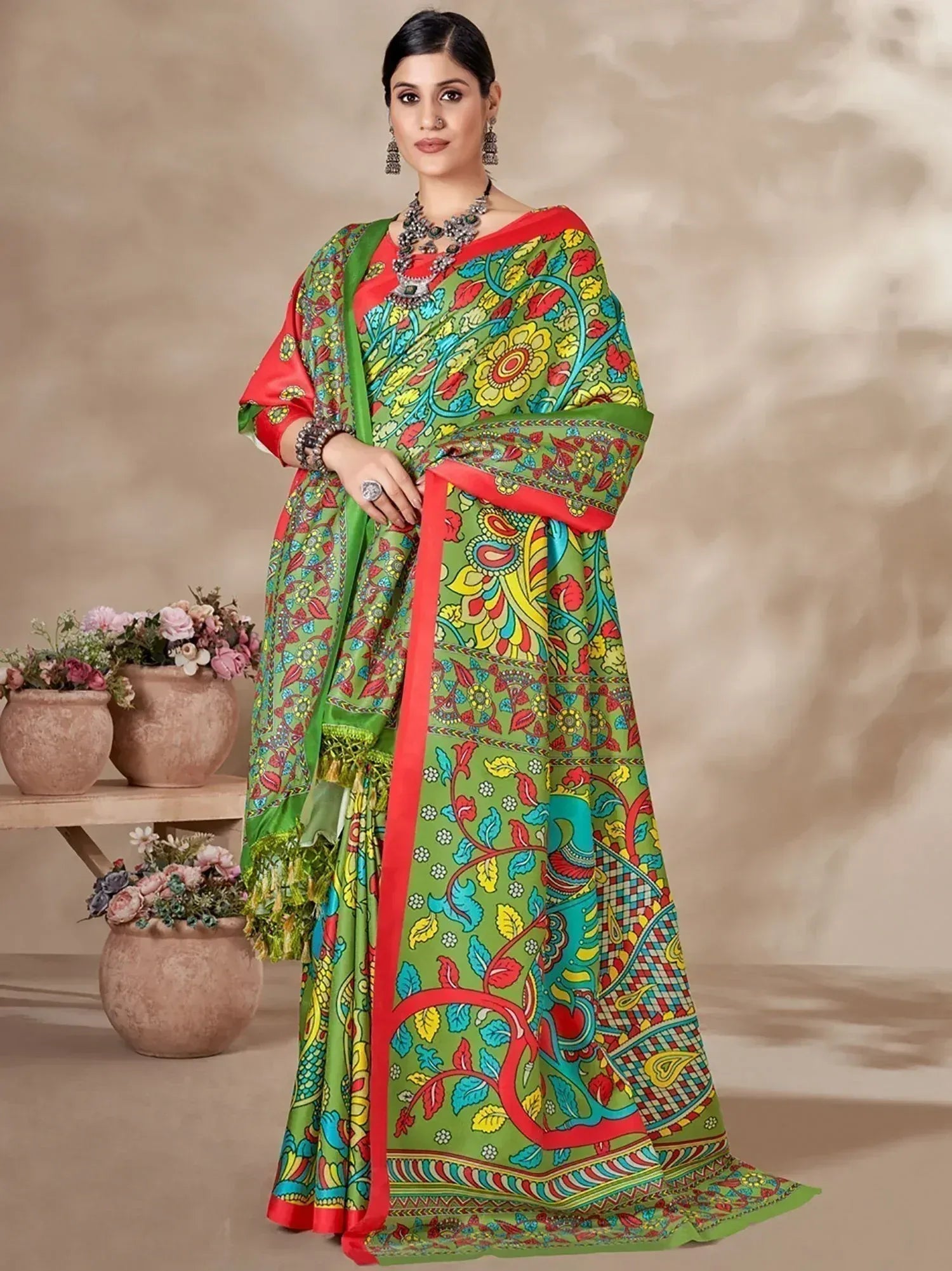 Vibrant green and red printed saree with floral paisley design, perfect for ethnic occasions