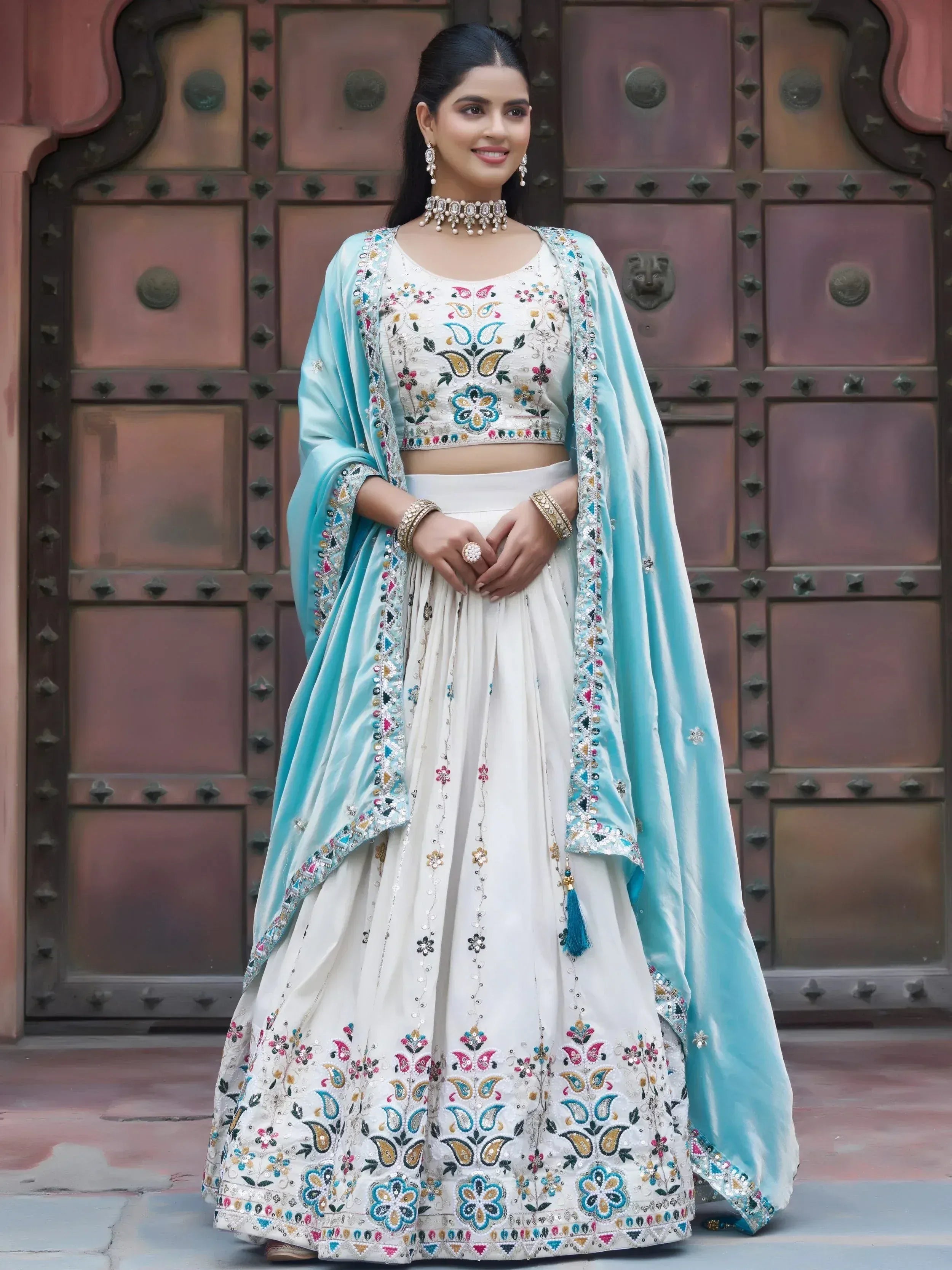 Mesmerising Off-White Sequnis Silk Lehenga Choli With Blue Dupatta 